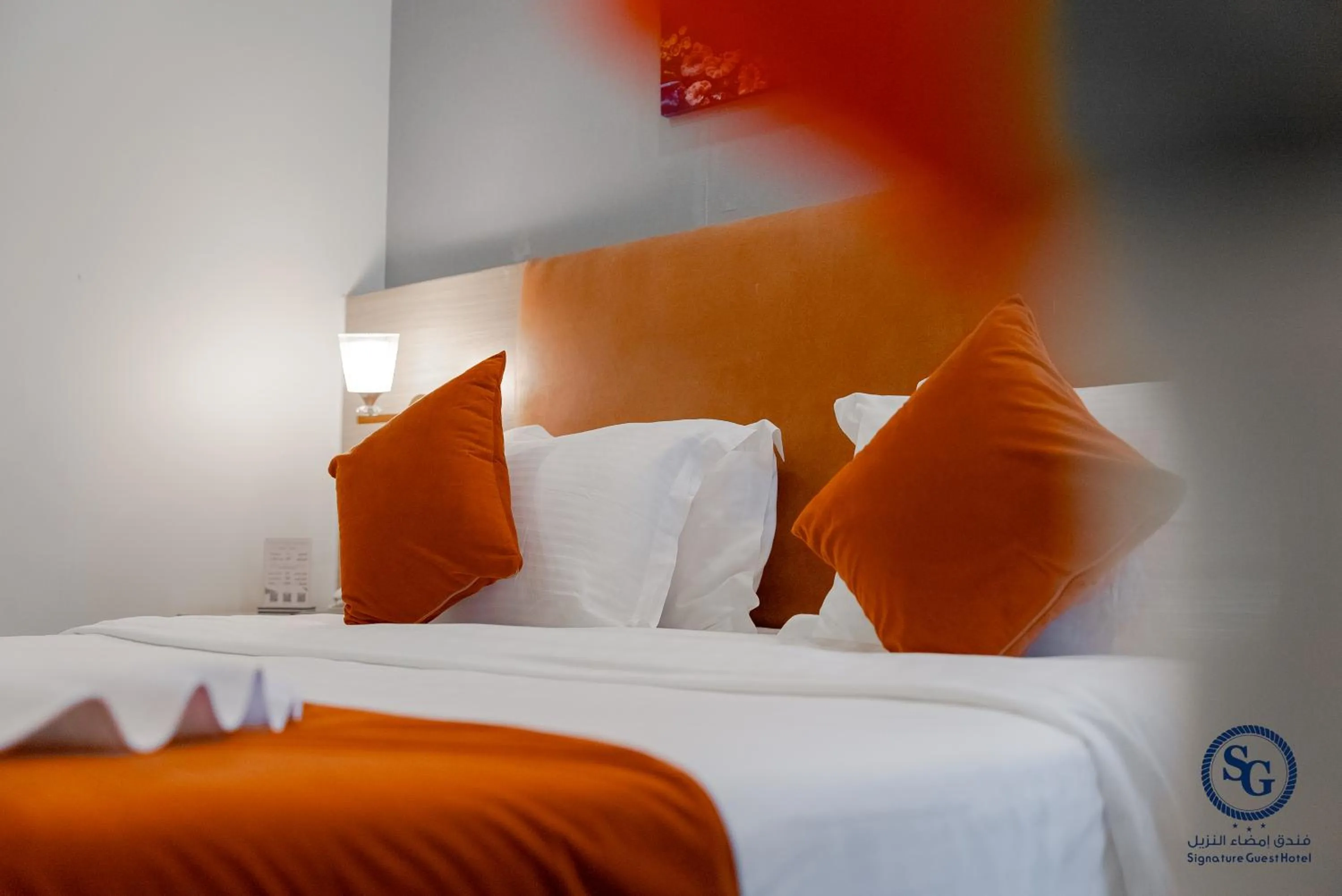 Bed in Signature Guest Hotel فندق إمضاء النزيل الفندقية