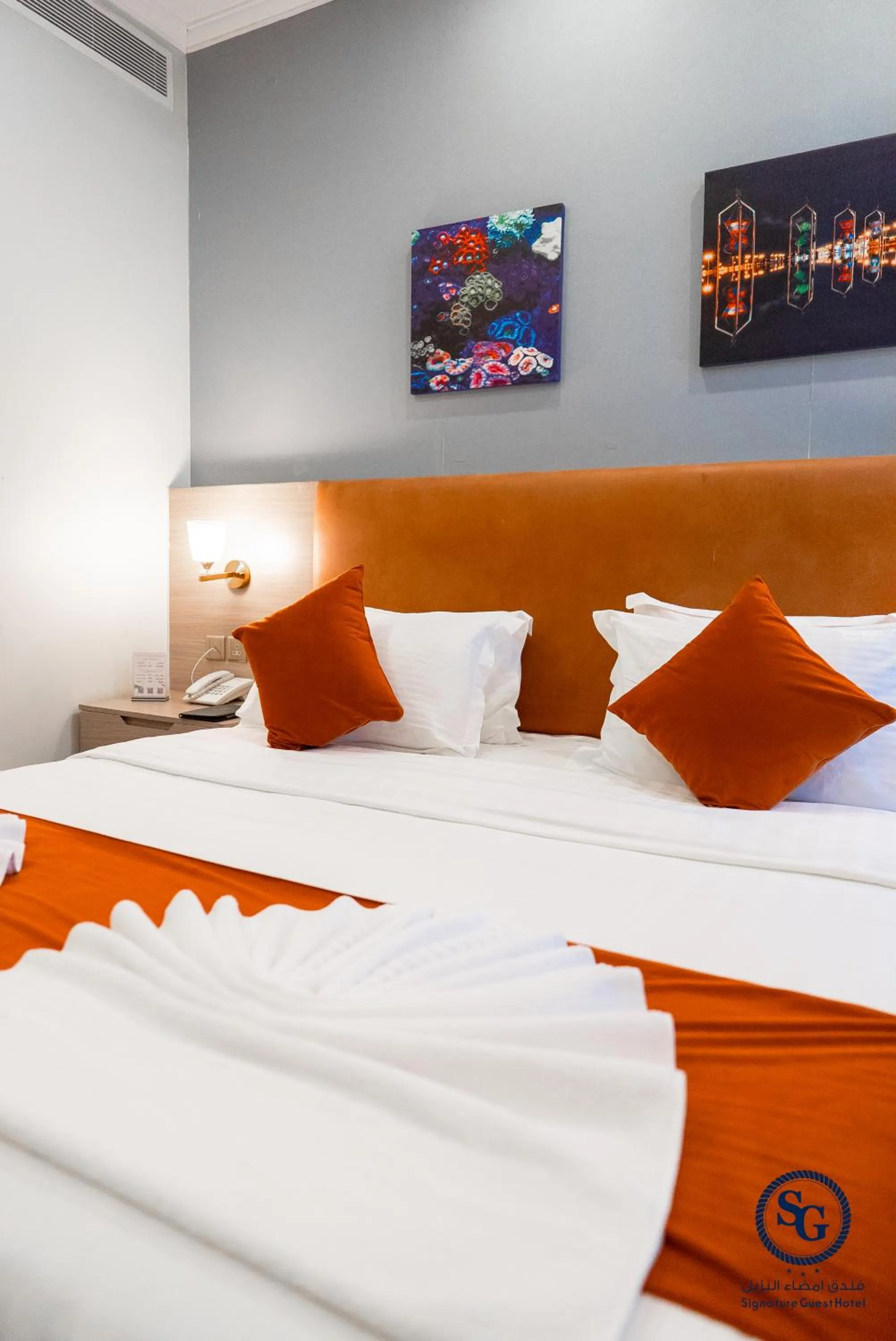 Bed in Signature Guest Hotel فندق إمضاء النزيل الفندقية