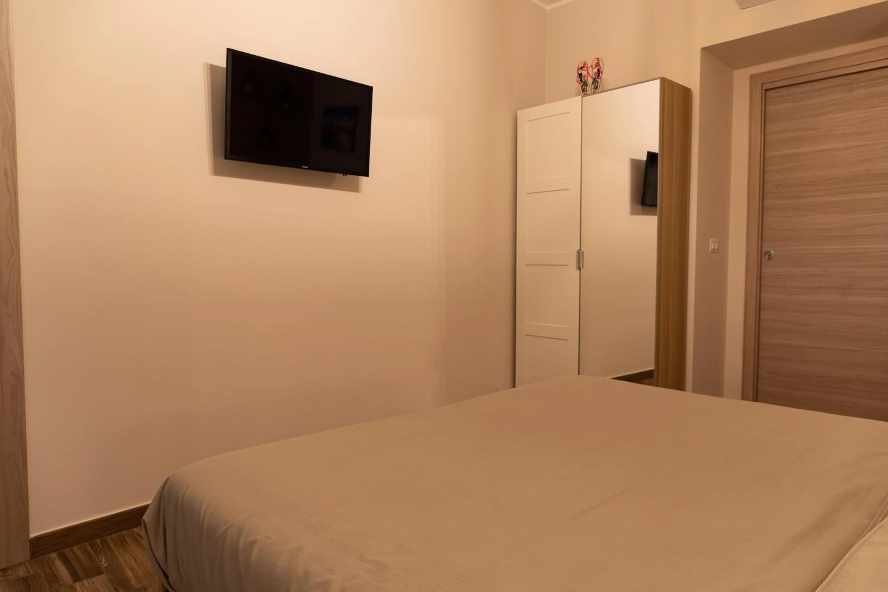 Bed in Tizzy Apartment & Rooms