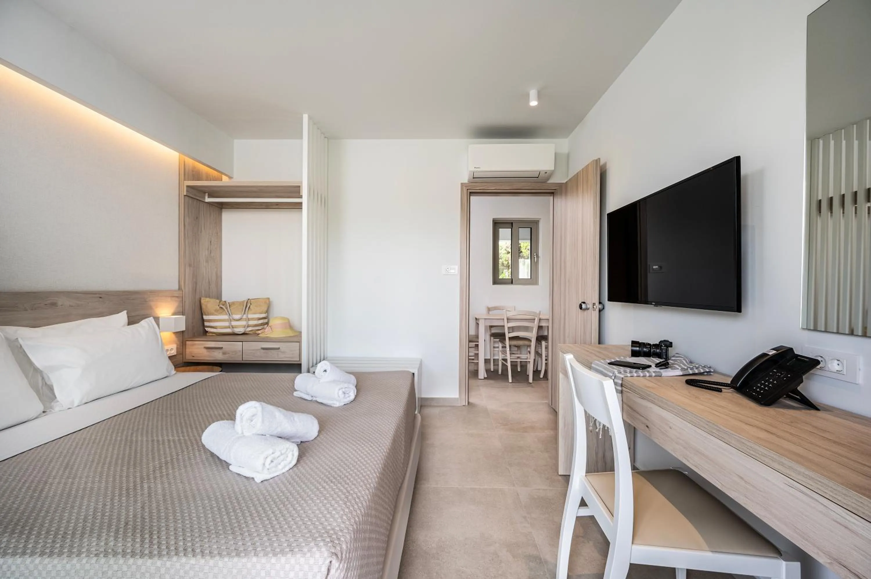 Bed in Mythos Suites Hotel