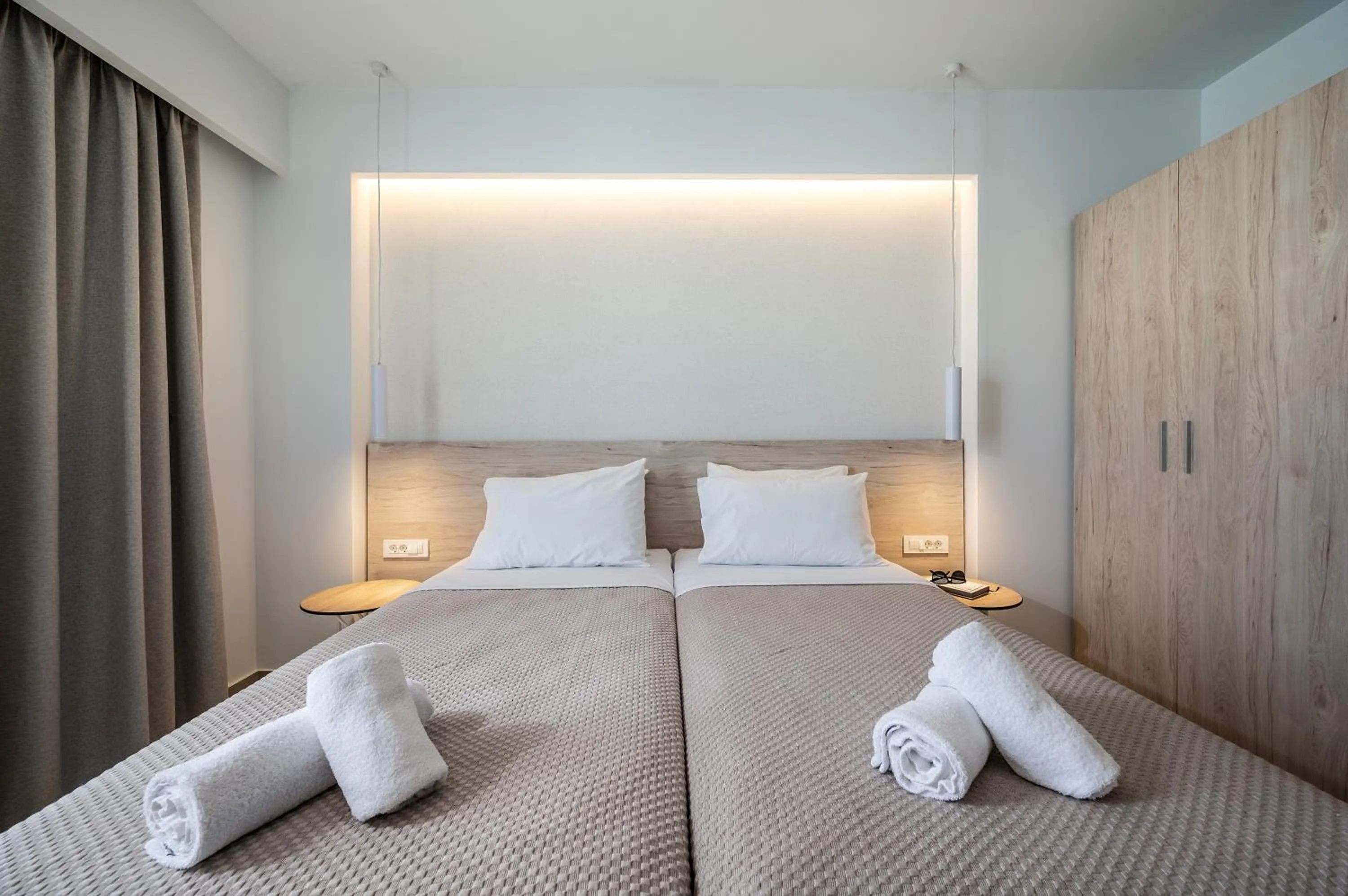 Bed in Mythos Suites Hotel