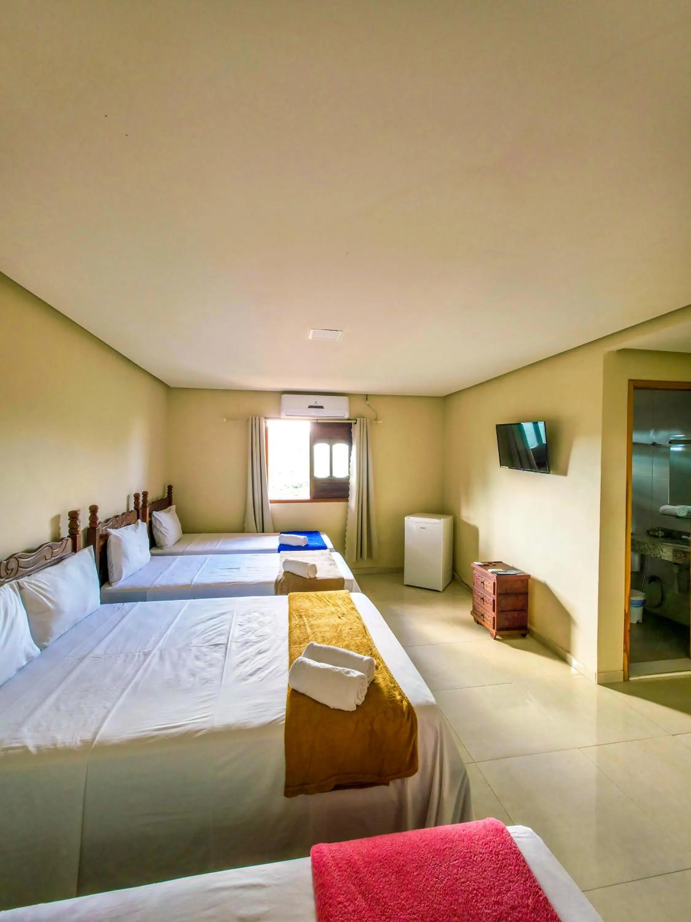 Bed in Vila Sancar Pousada