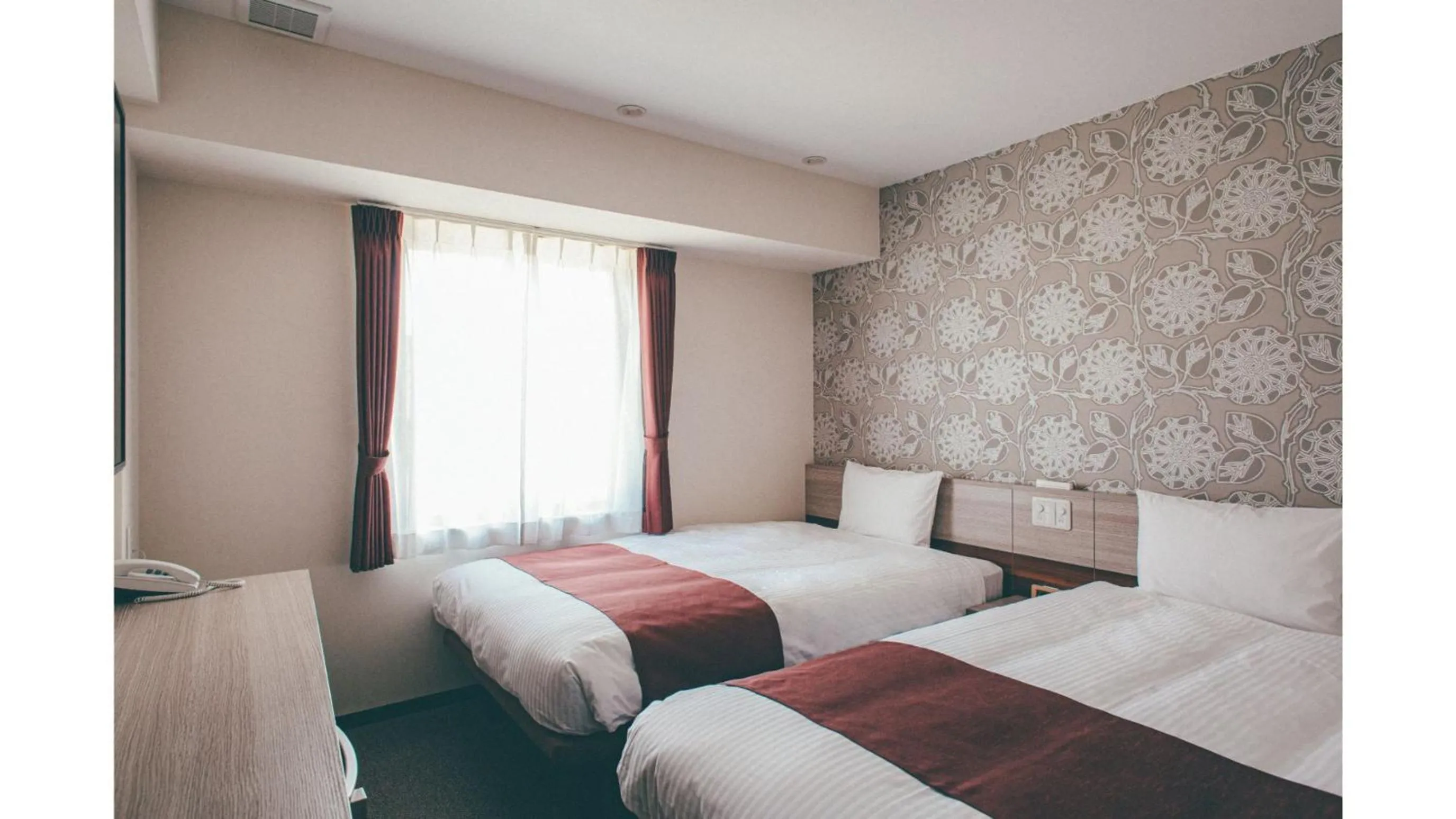 Bed in Kuretake Inn Premium Shizuoka Annex