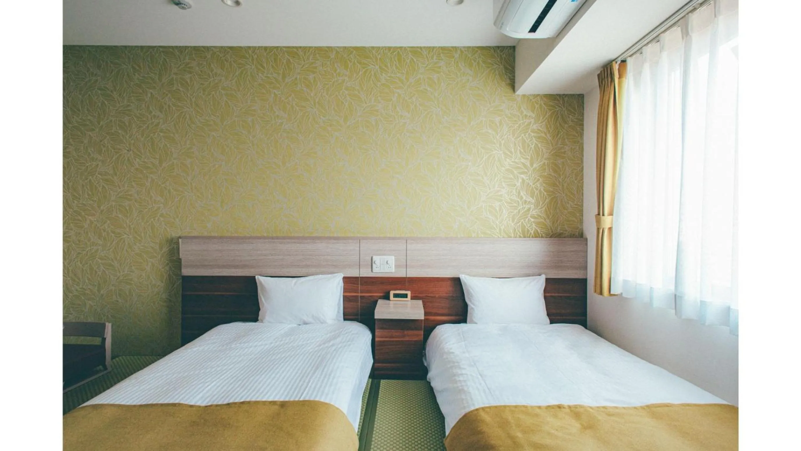 Bed in Kuretake Inn Premium Shizuoka Annex