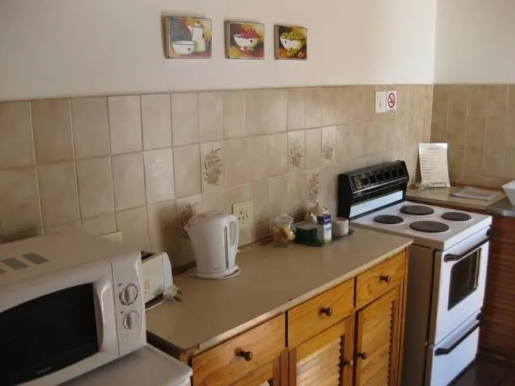 Kitchen or kitchenette in Camdeboo Cottages