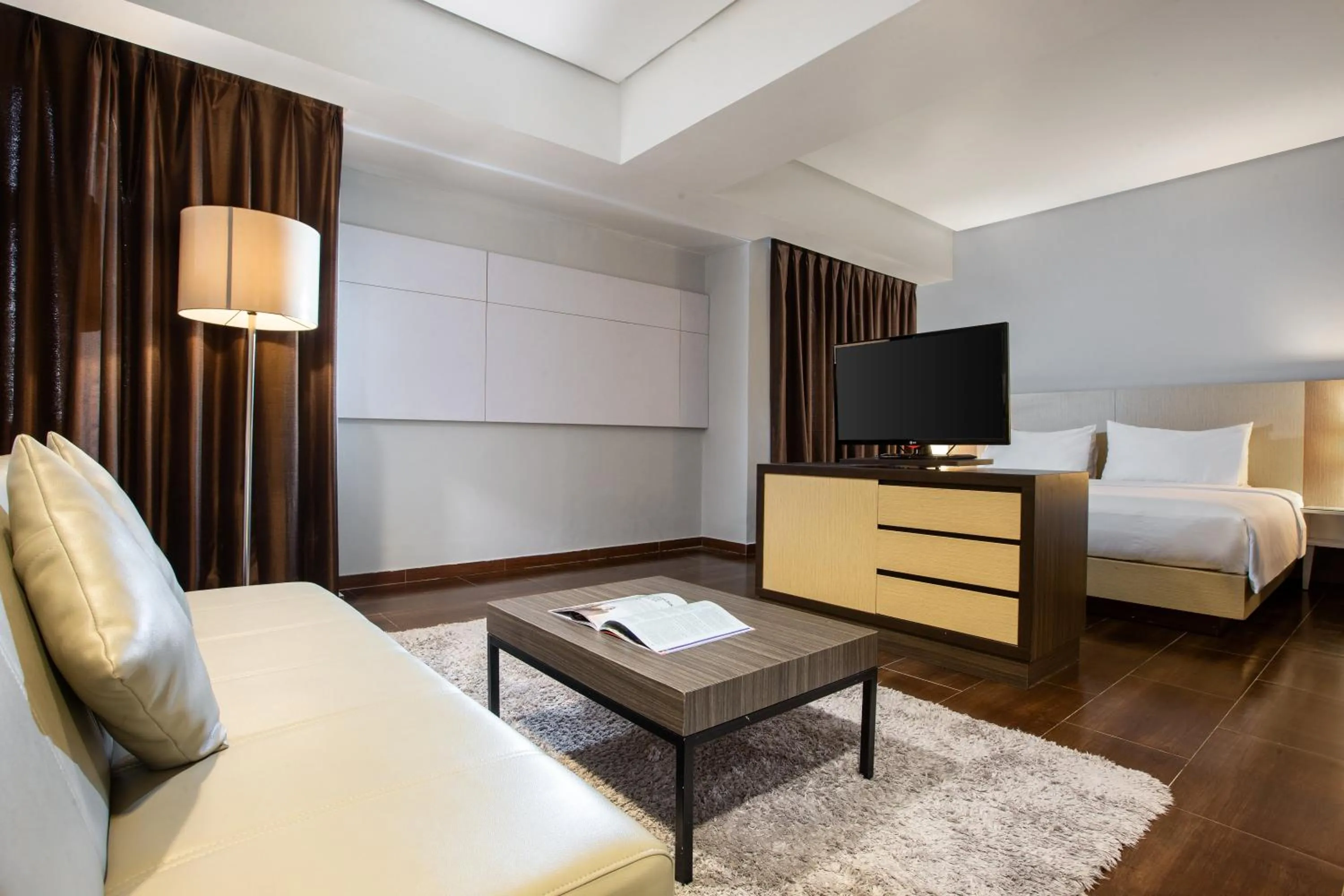 Living room, Bed in Hotel Santika Depok