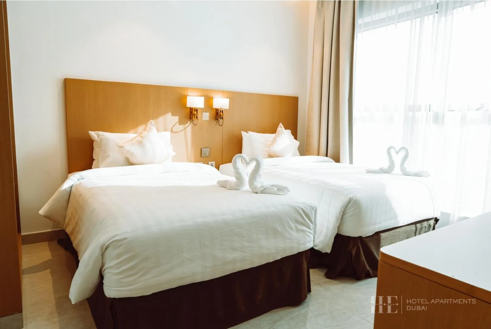 Bed in HE Hotel Apartments