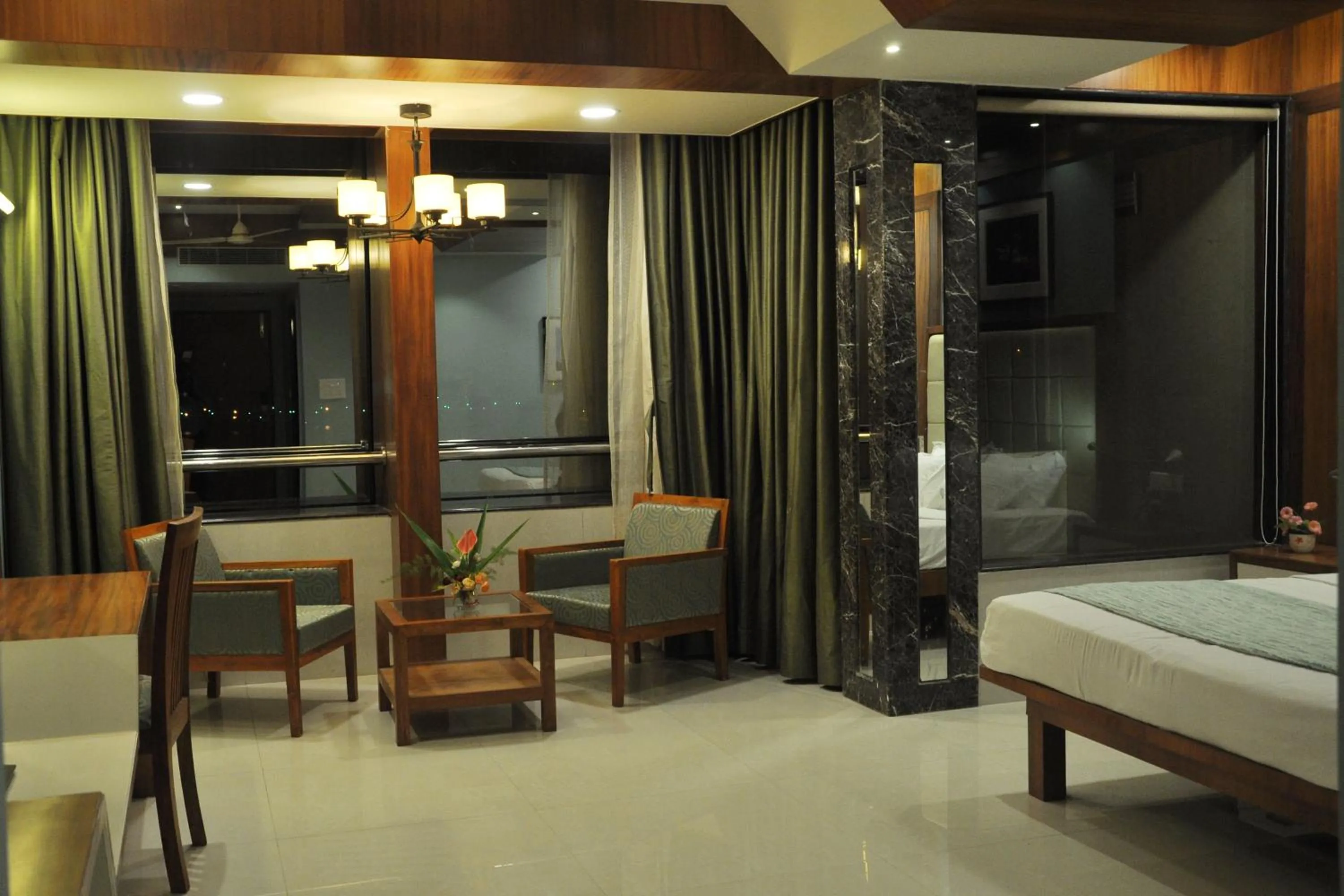 Seating area, Bed in Panaji Residency