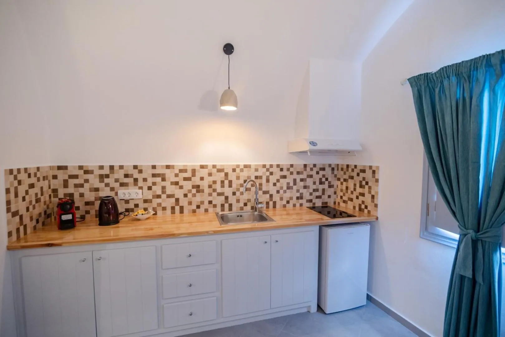 kitchen in Sun Angelos Oia - Luxury Cave Suites
