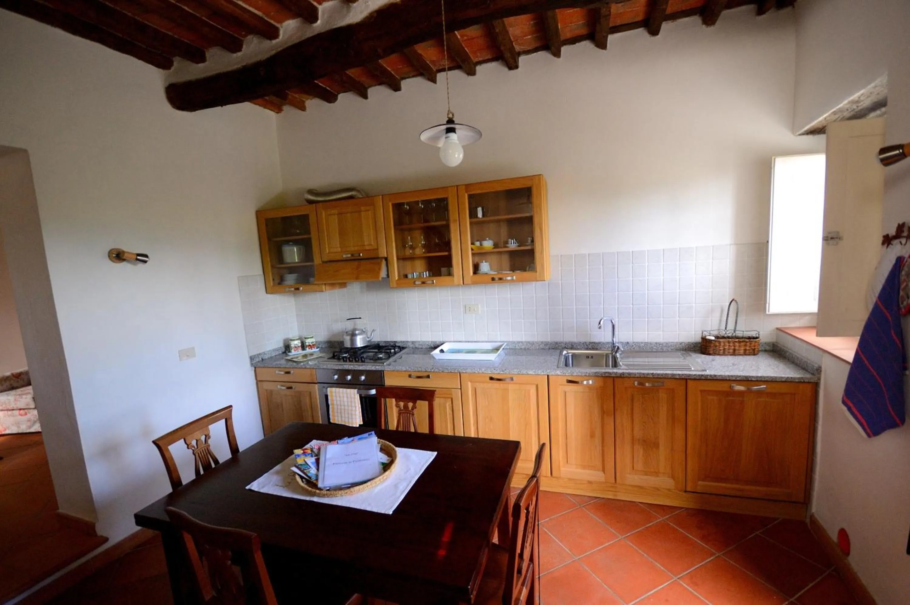 Kitchen or kitchenette in Fattoria di Fubbiano