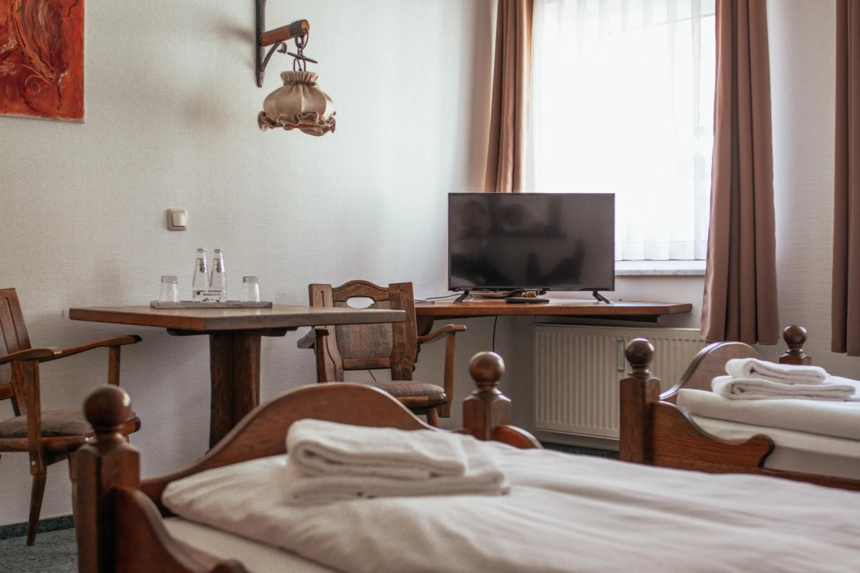 Seating area, Bed in REGIOHOTEL Wolmirstedter Hof Wolmirstedt