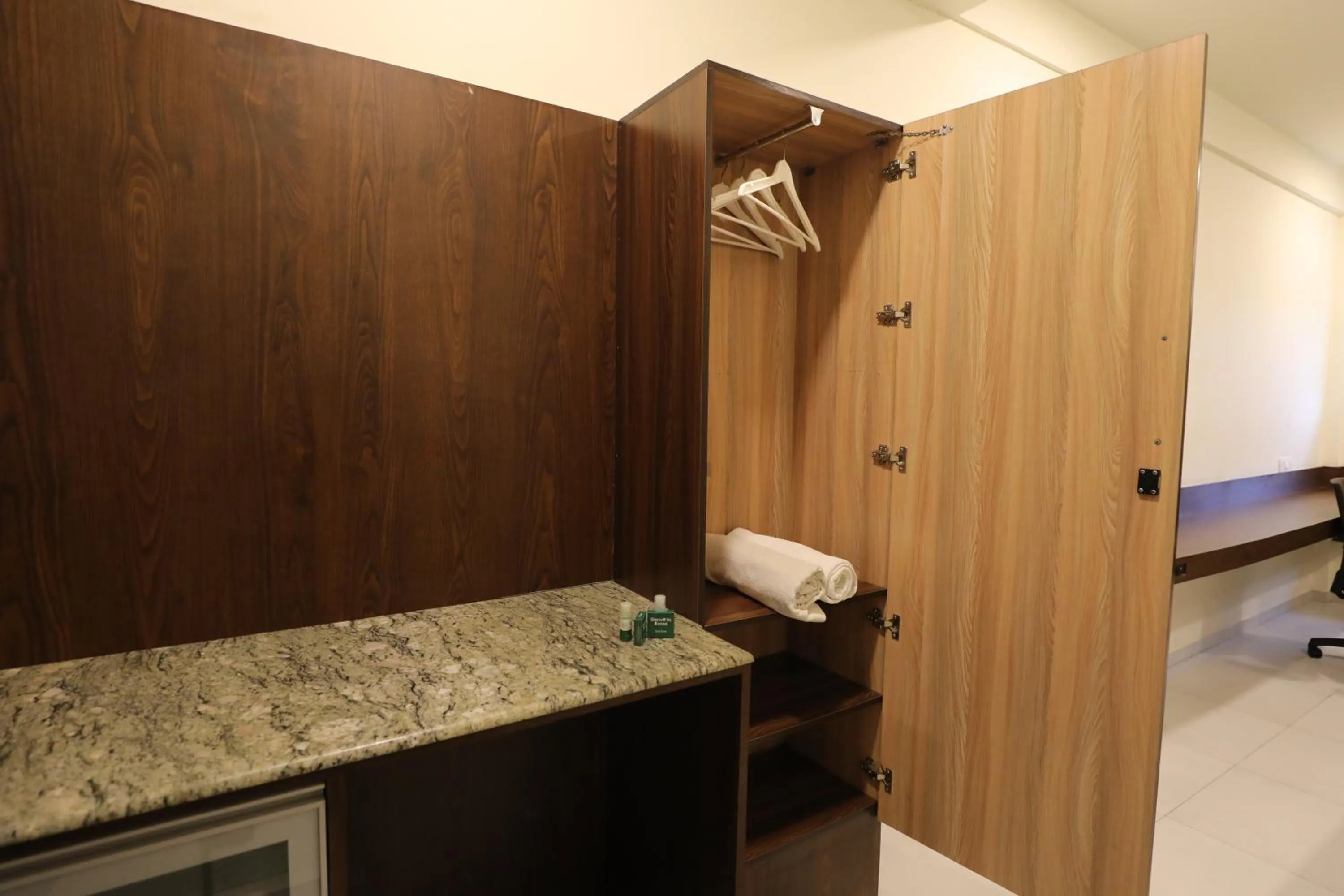 Bed in Greenotel Rooms Hazira, Surat