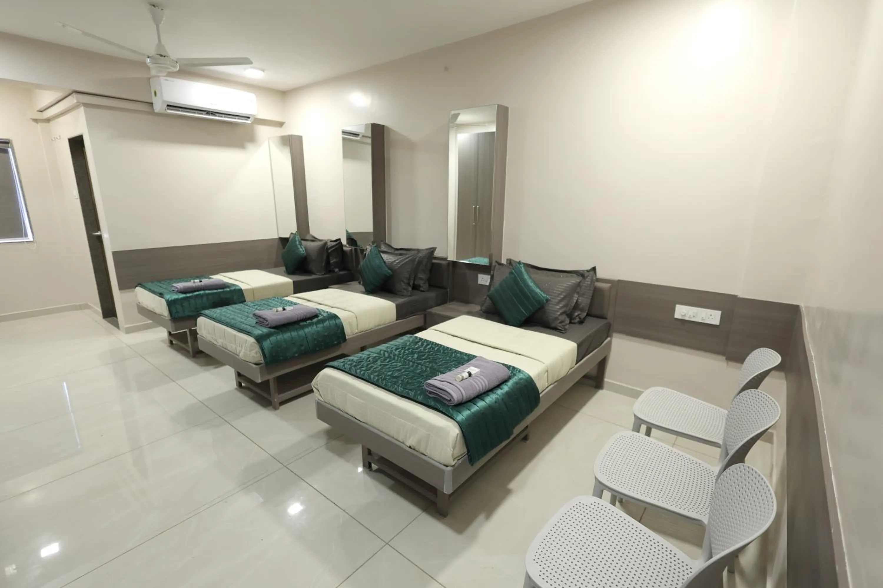 Photo of the whole room, Bed in Greenotel Rooms Hazira, Surat