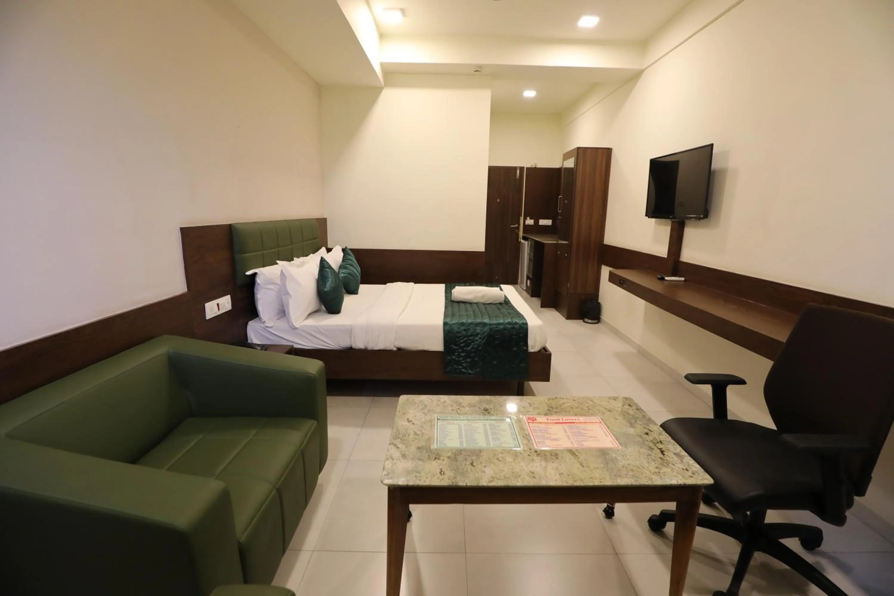 Bed in Greenotel Rooms Hazira, Surat