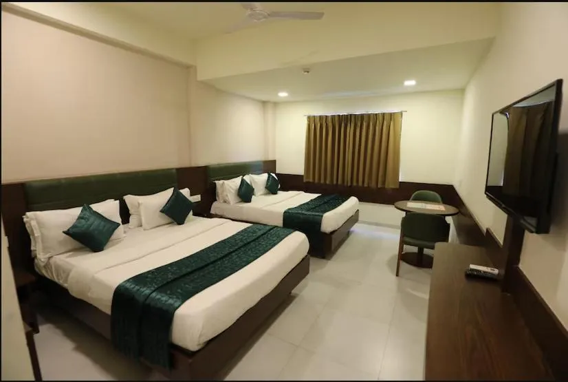 Bed in Greenotel Rooms Hazira, Surat