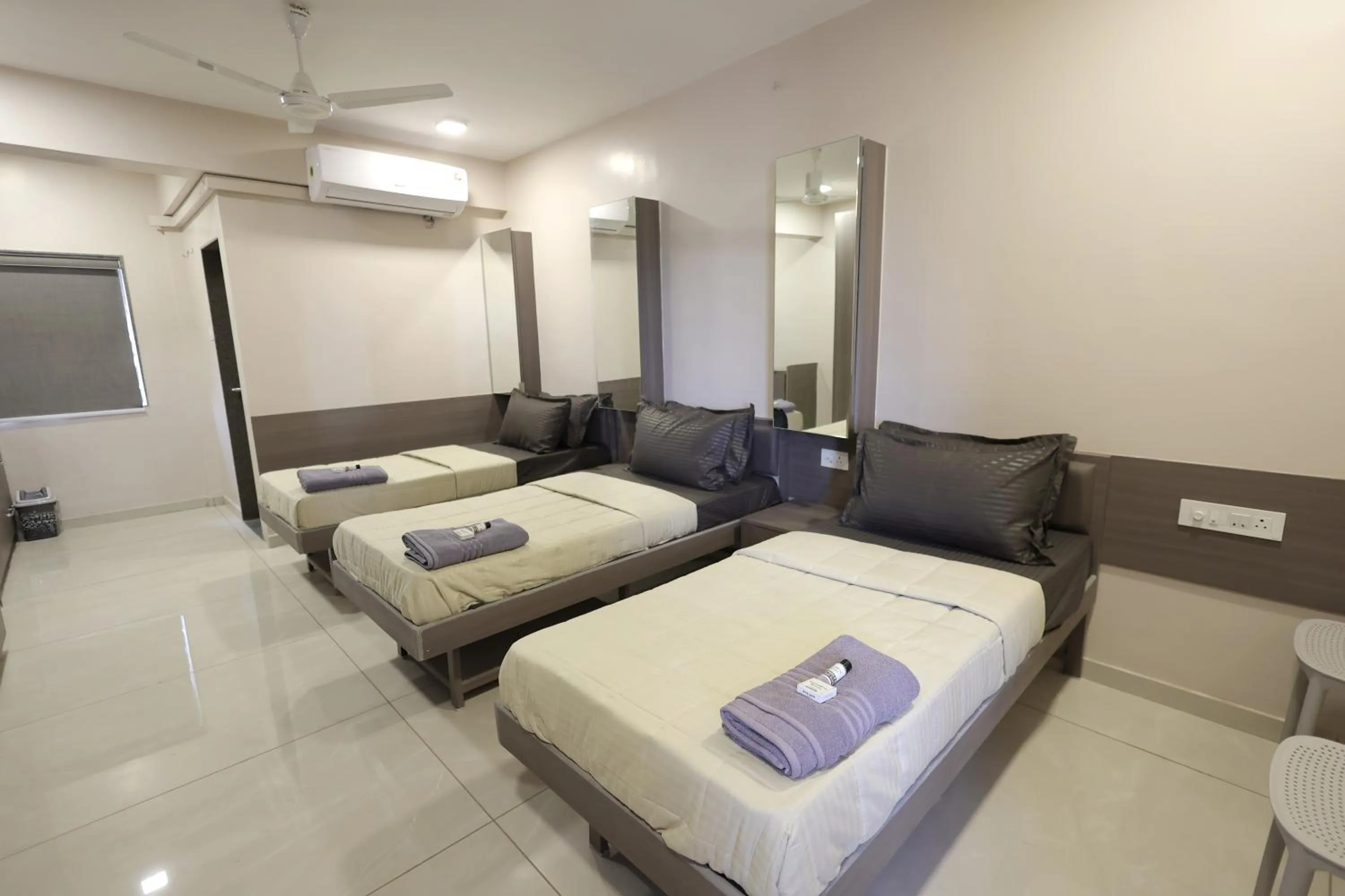 Photo of the whole room, Bed in Greenotel Rooms Hazira, Surat