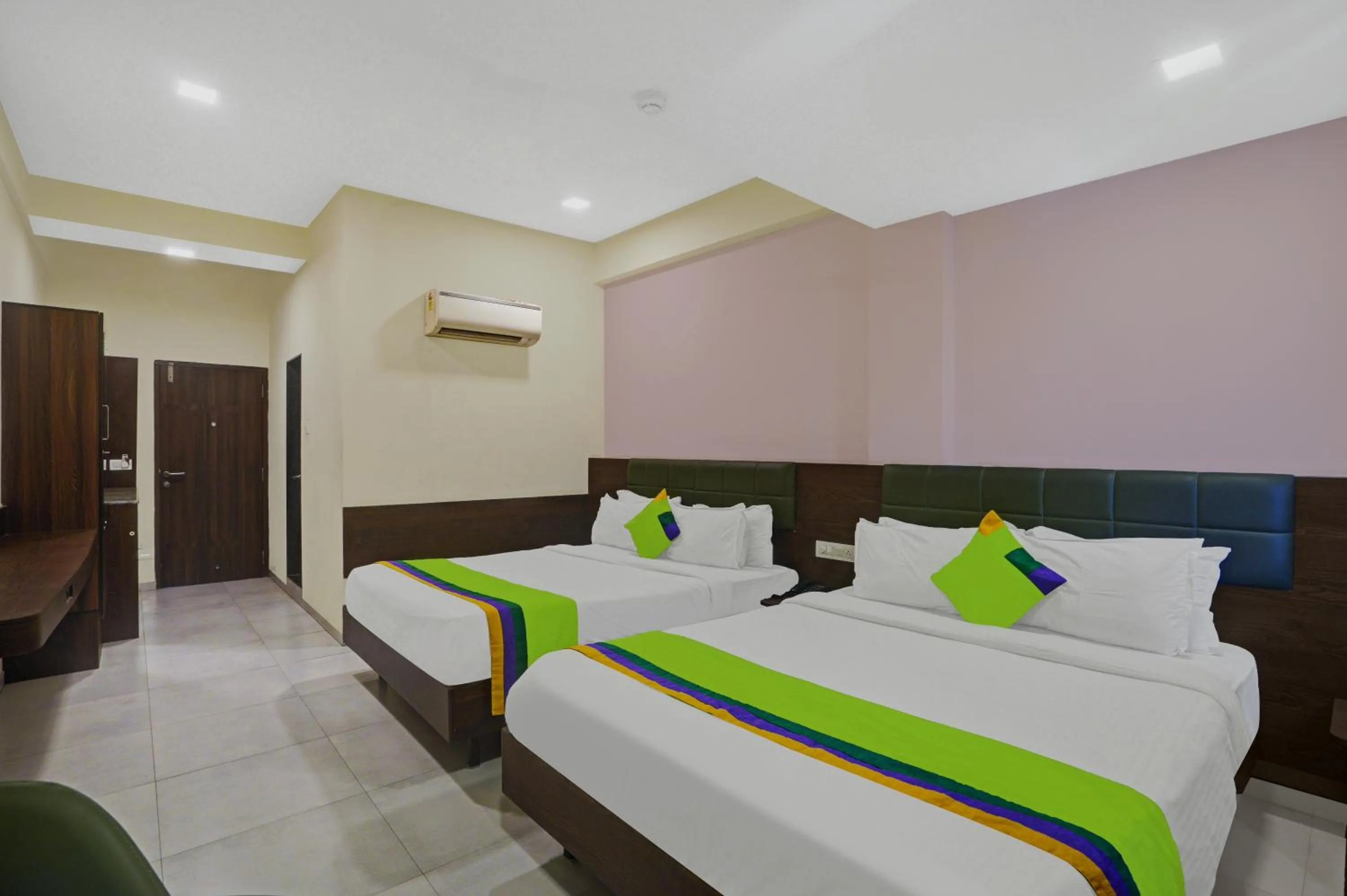 Bed in Greenotel Rooms Hazira, Surat