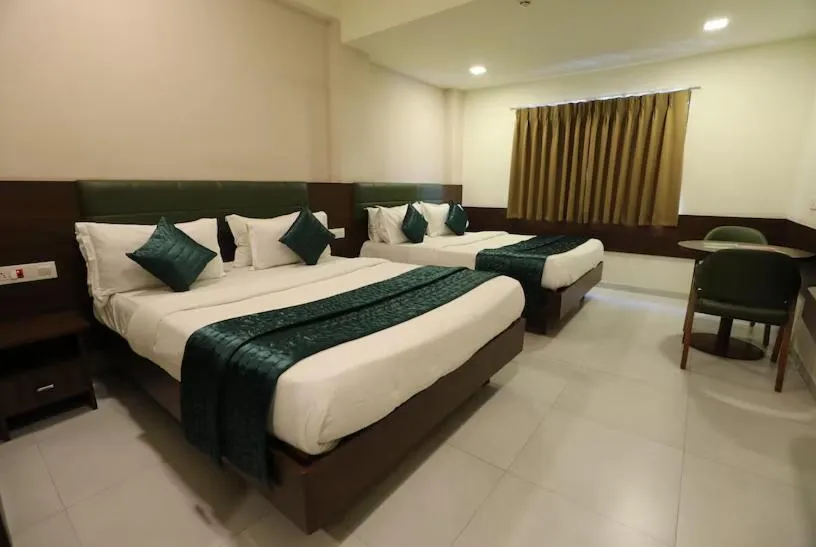 Bed in Greenotel Rooms Hazira, Surat