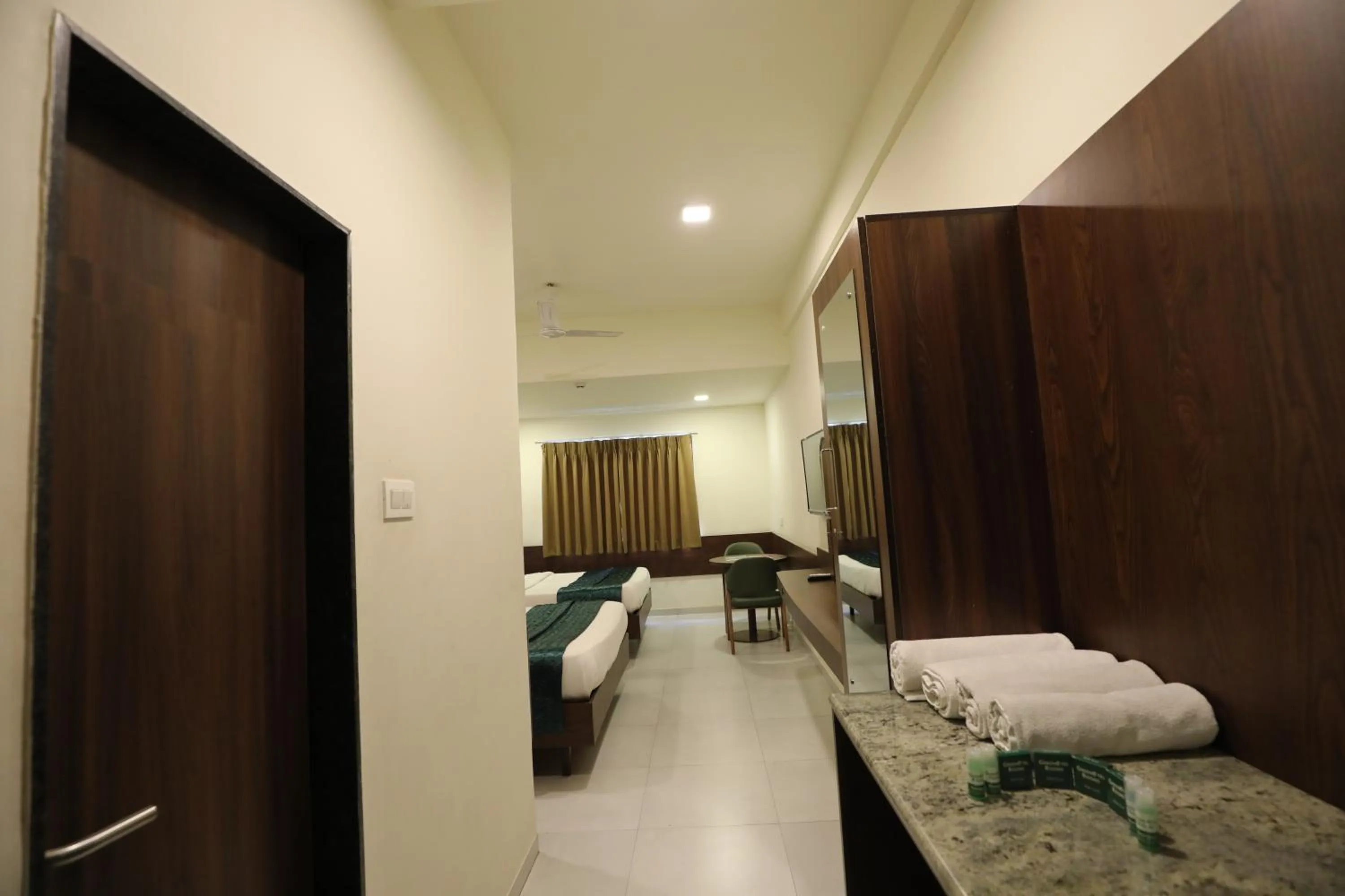 Bed in Greenotel Rooms Hazira, Surat