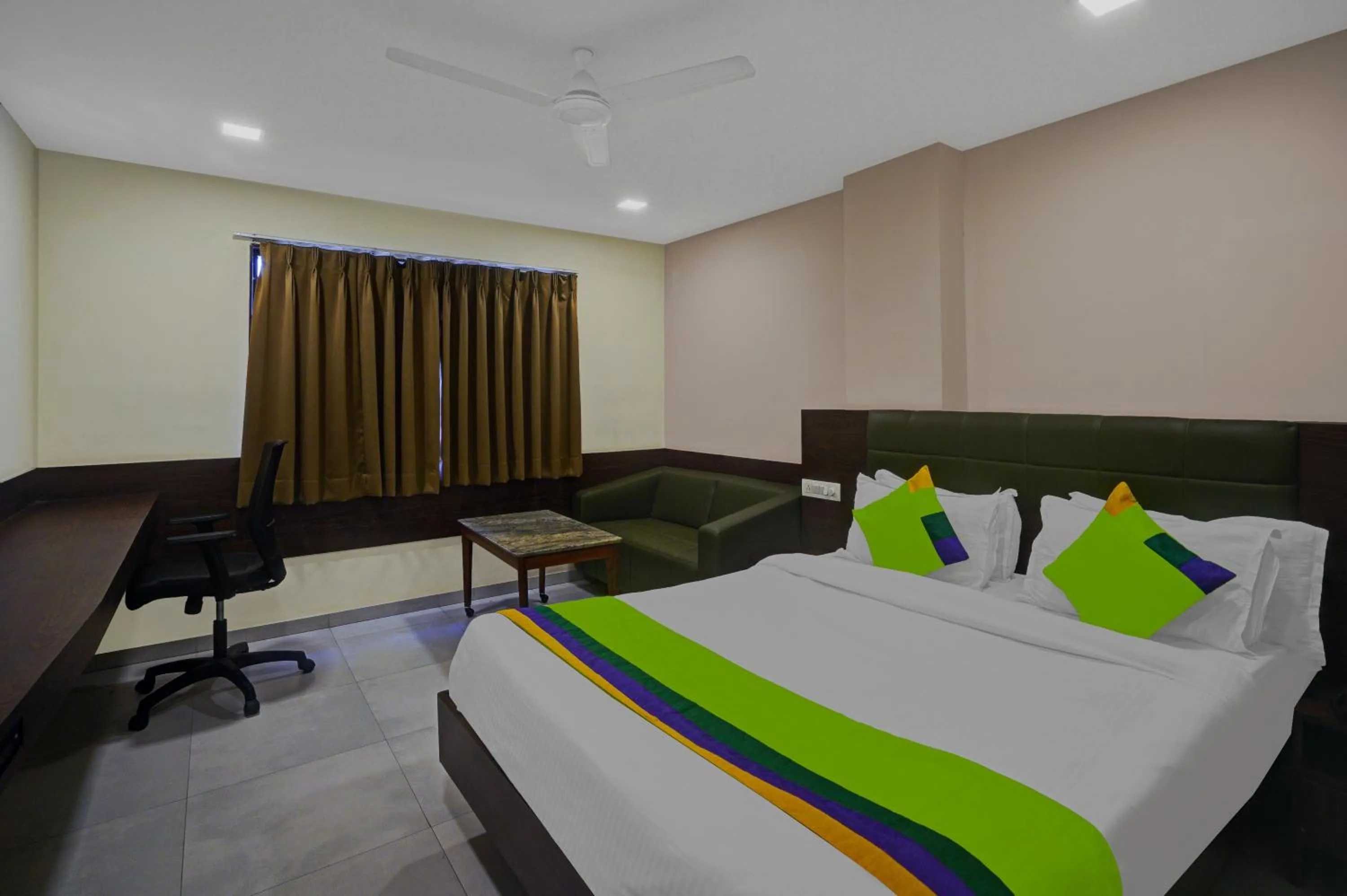 Bed in Greenotel Rooms Hazira, Surat
