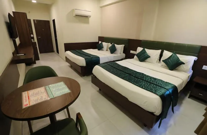 Bed in Greenotel Rooms Hazira, Surat