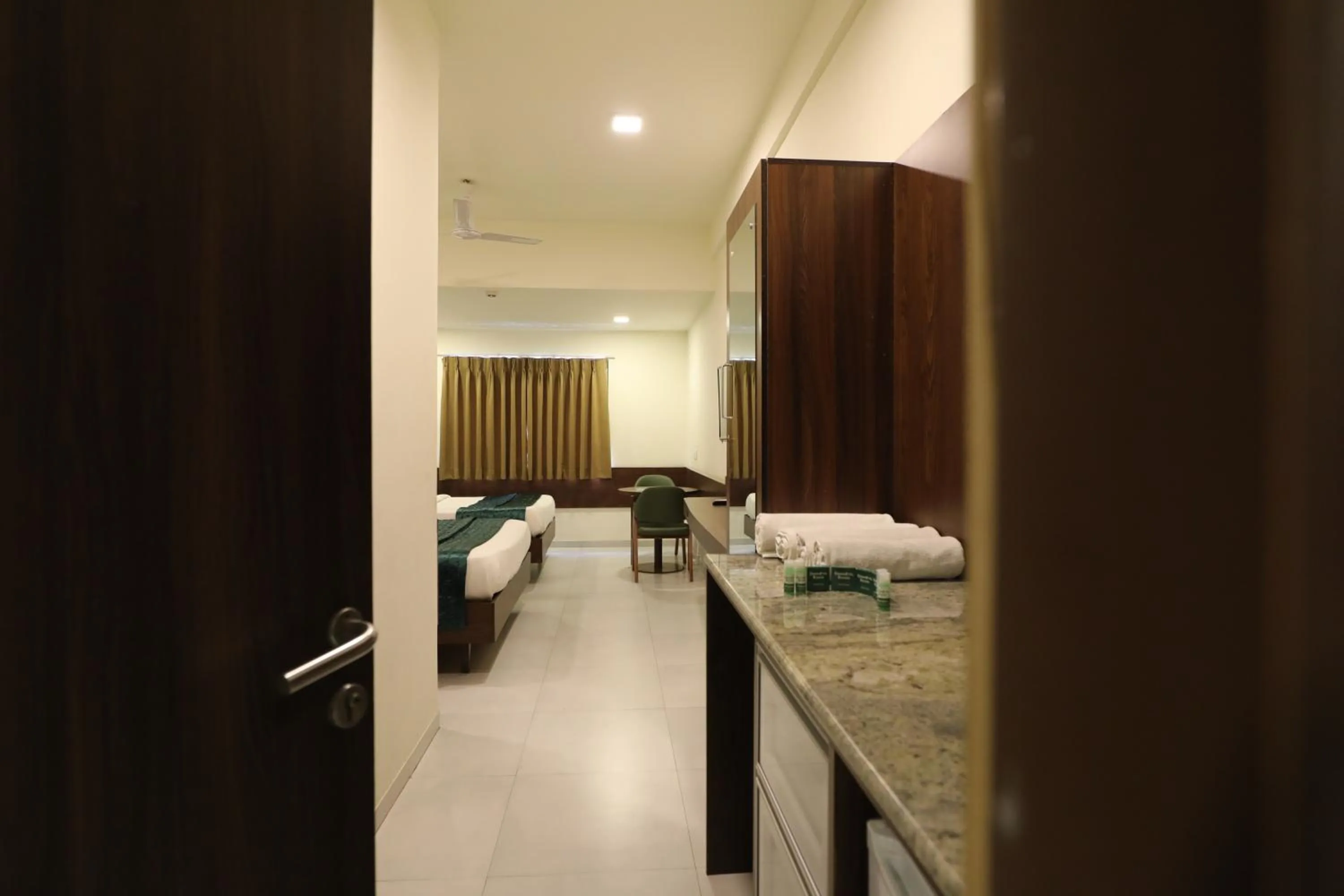 Bed in Greenotel Rooms Hazira, Surat