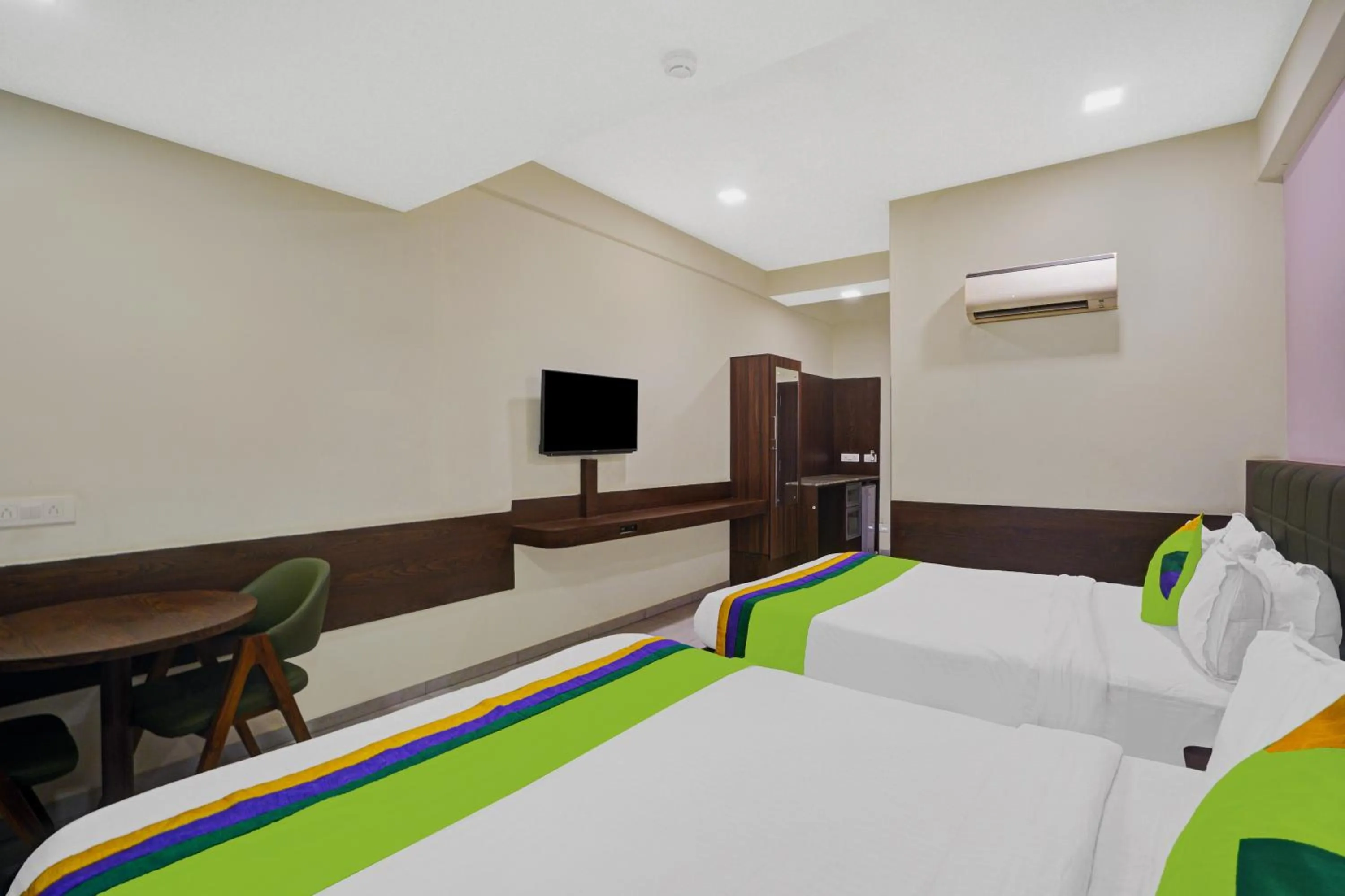 Bed in Greenotel Rooms Hazira, Surat