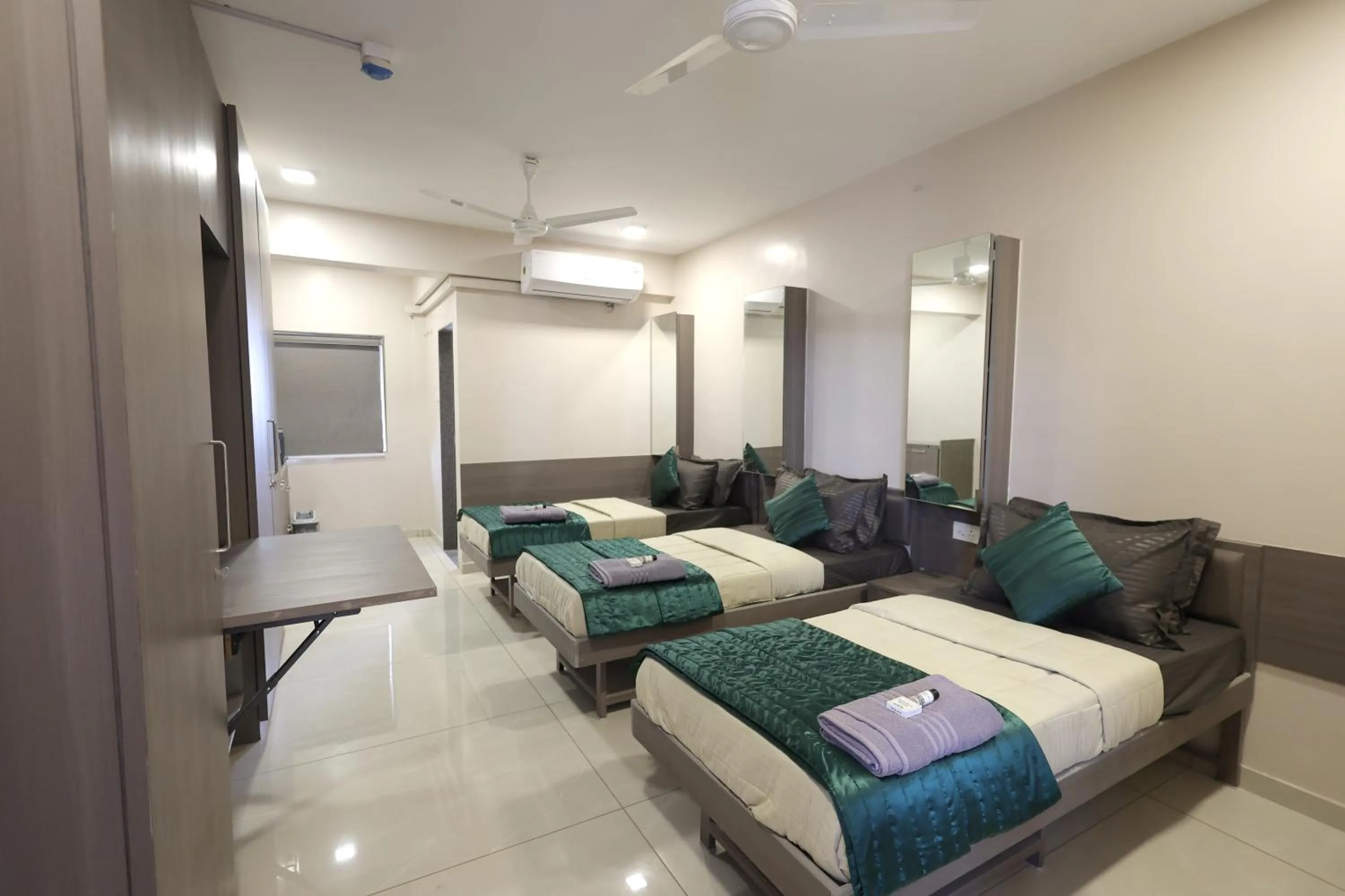 Photo of the whole room, Bed in Greenotel Rooms Hazira, Surat