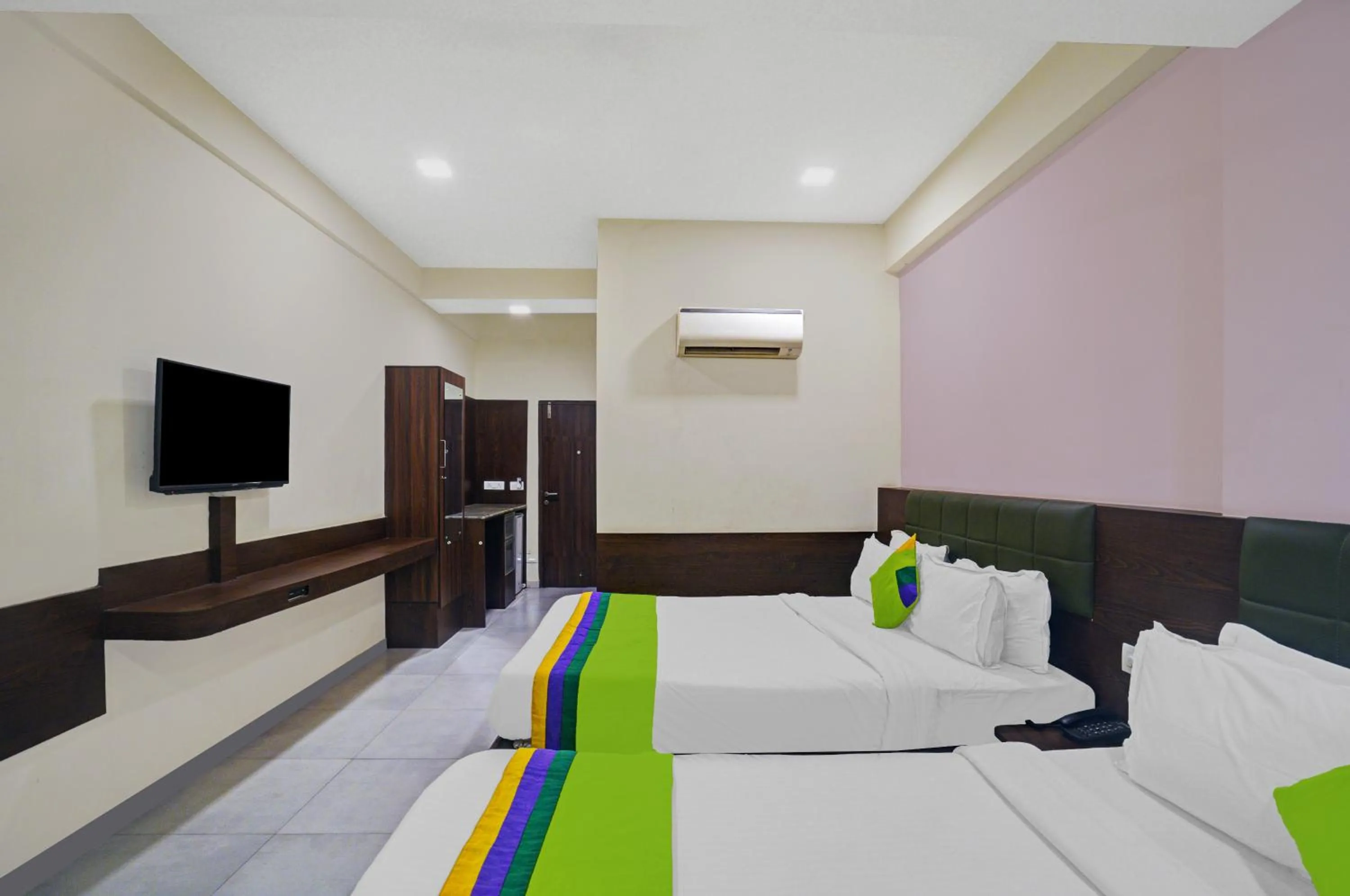 Bed in Greenotel Rooms Hazira, Surat