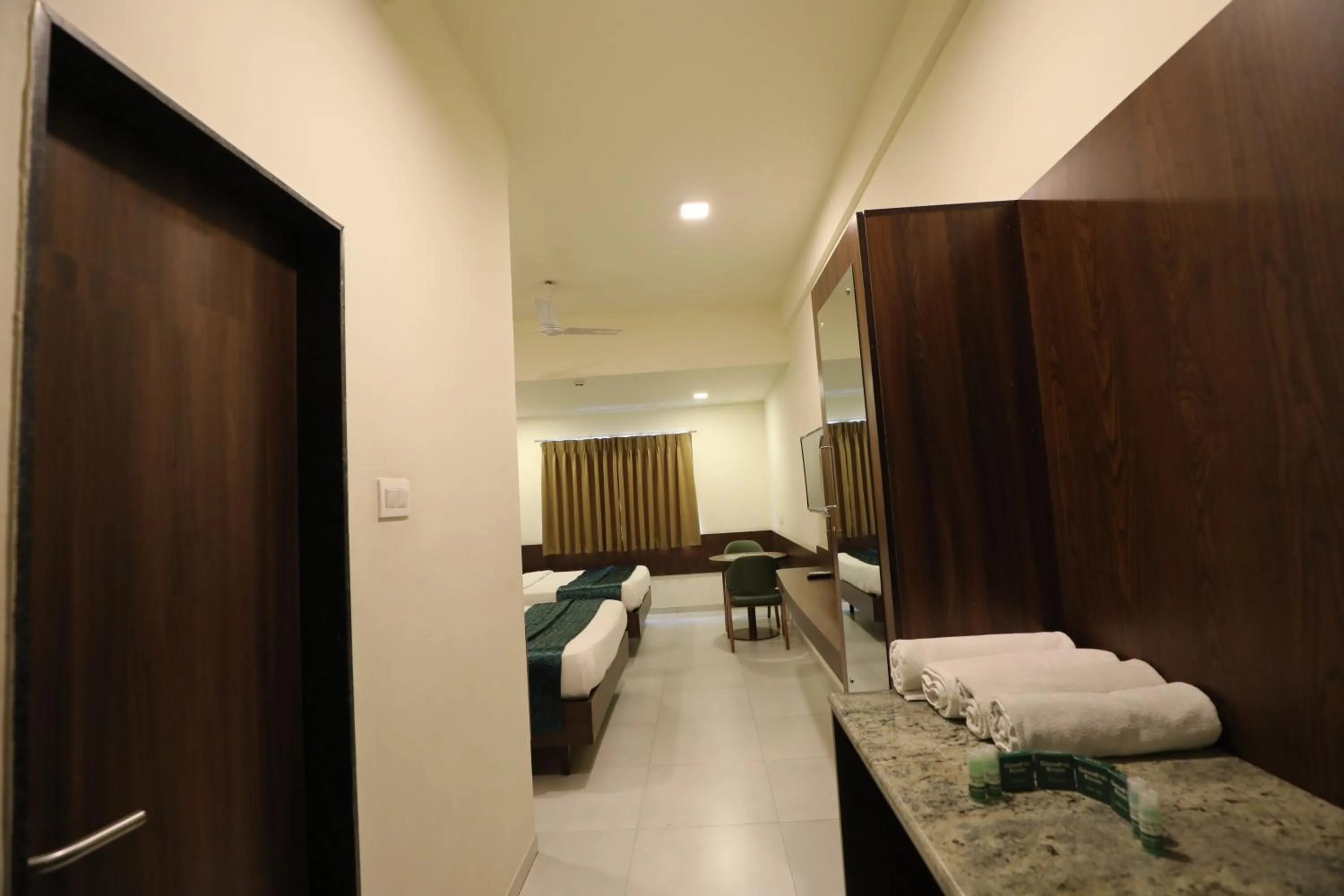 Bed in Greenotel Rooms Hazira, Surat