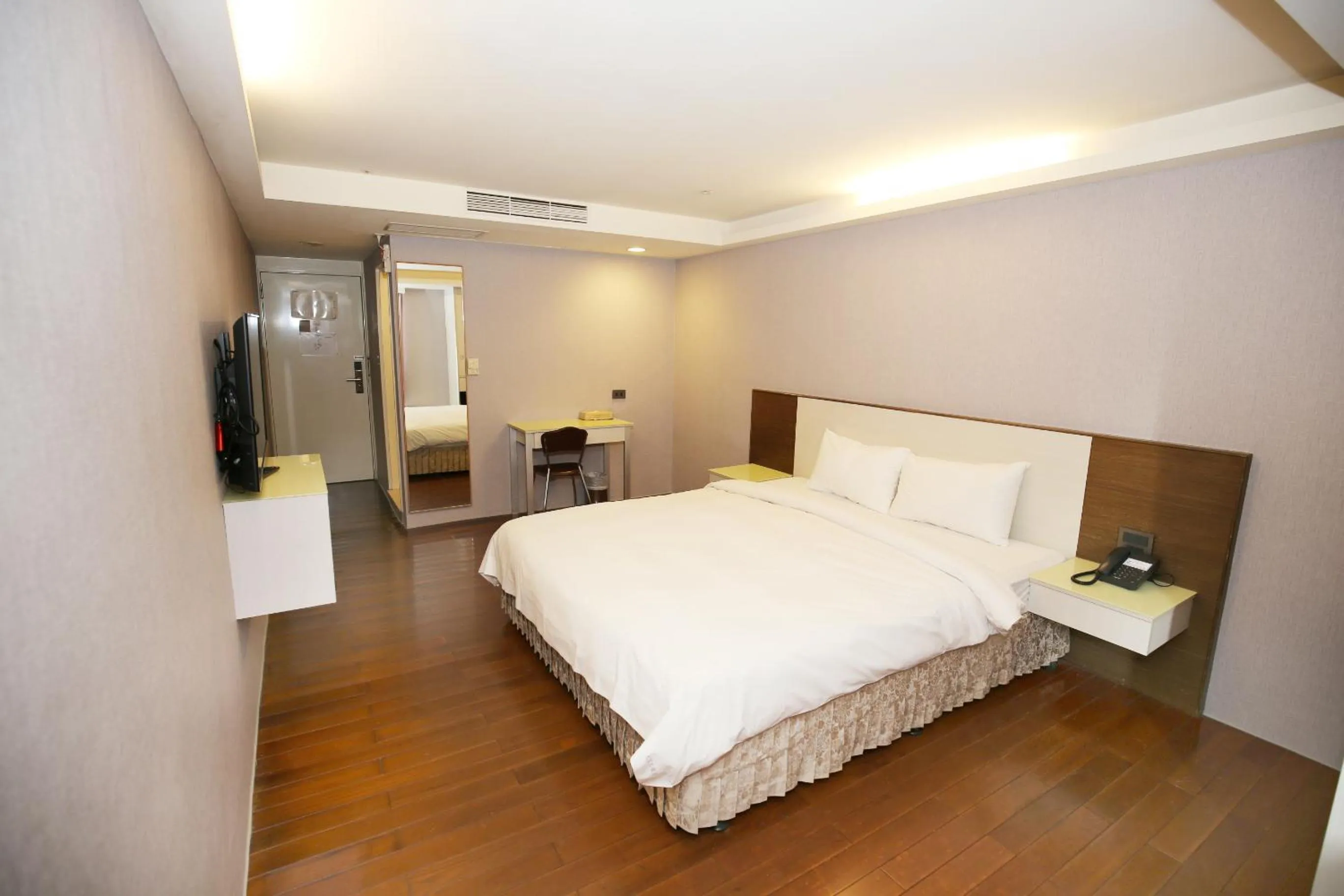 Bed in Tai Shinu Hotel