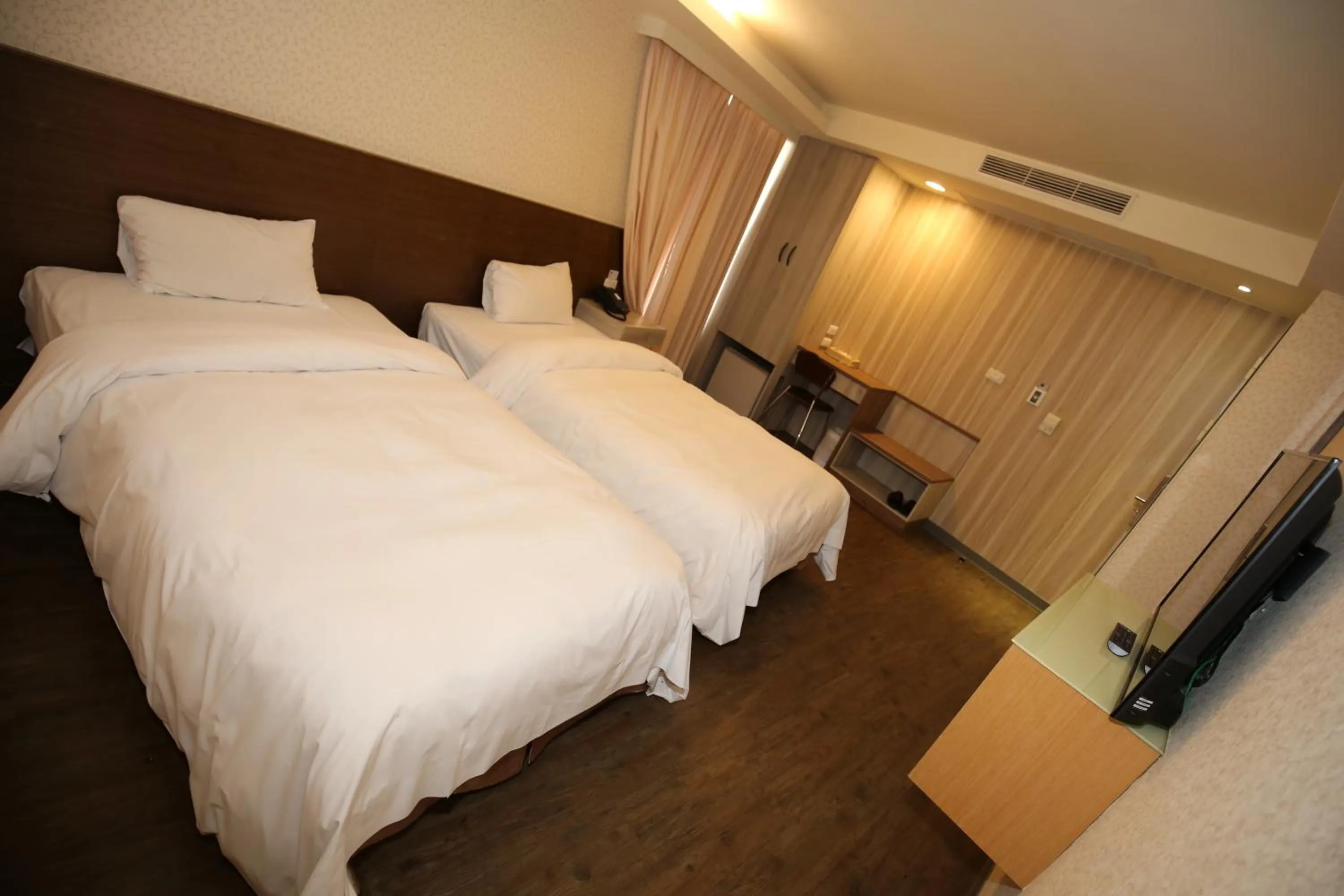 Bed in Tai Shinu Hotel