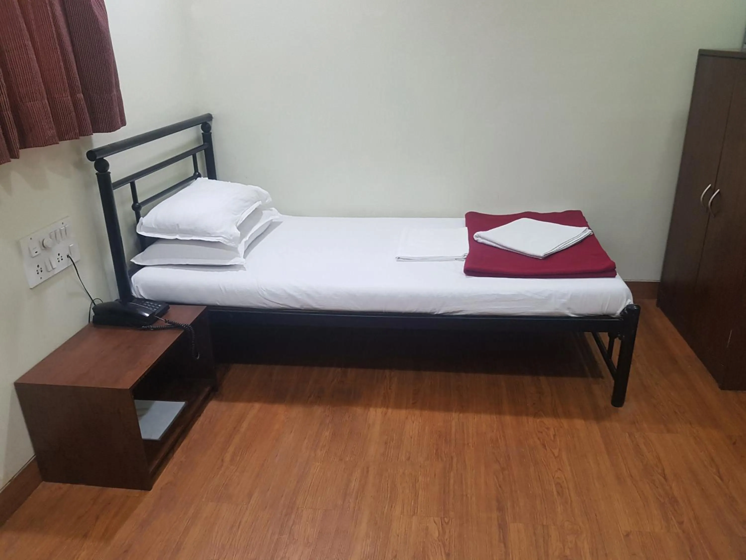 Bed in Hotel Kumkum