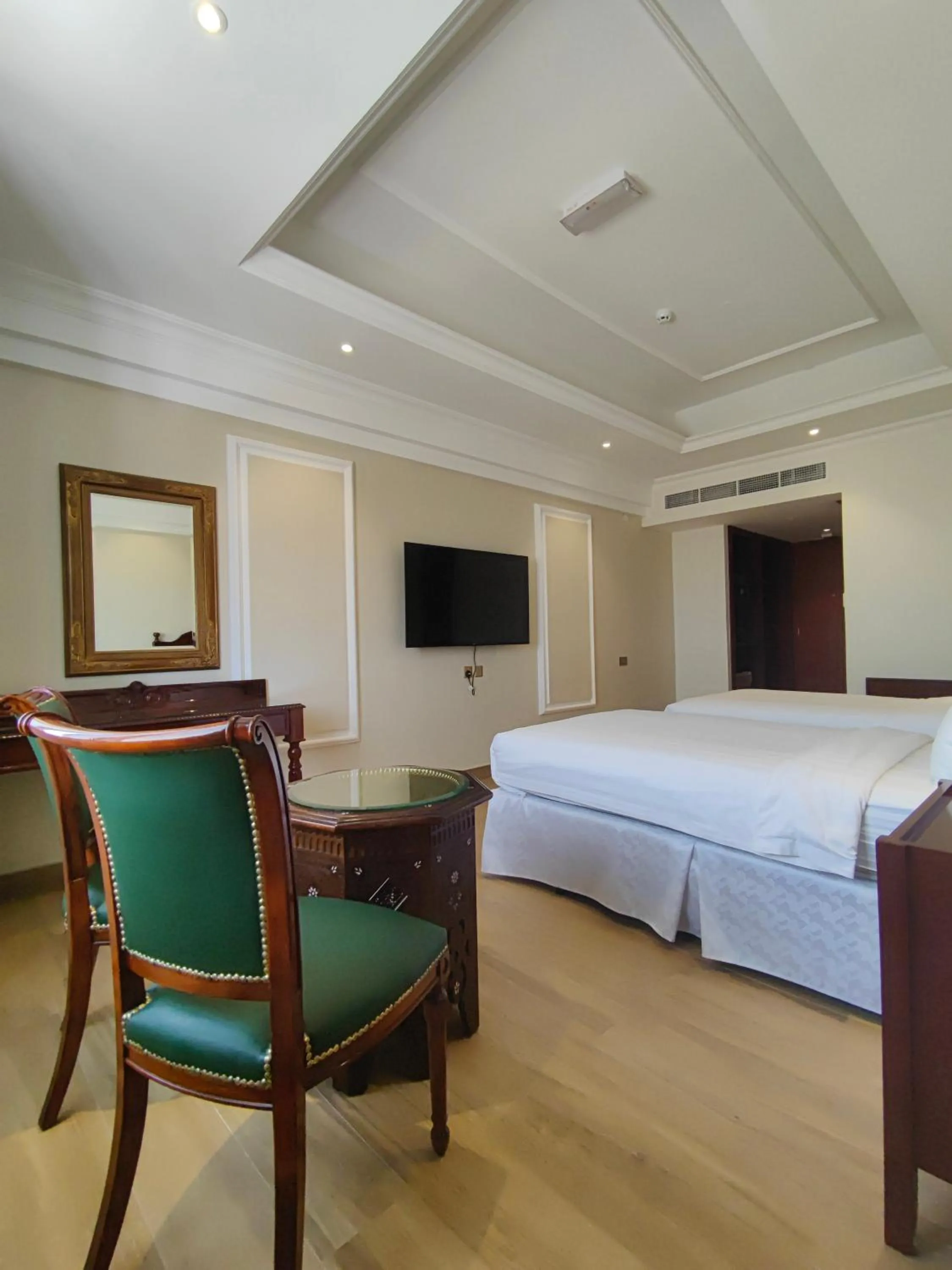 Communal lounge/ TV room, Bed in ALYA Hotel