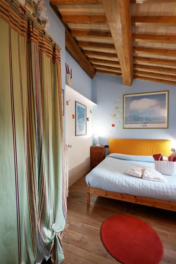 Bed in B&B and Wellness Il Pomario di Montepiglio Resort Naturista