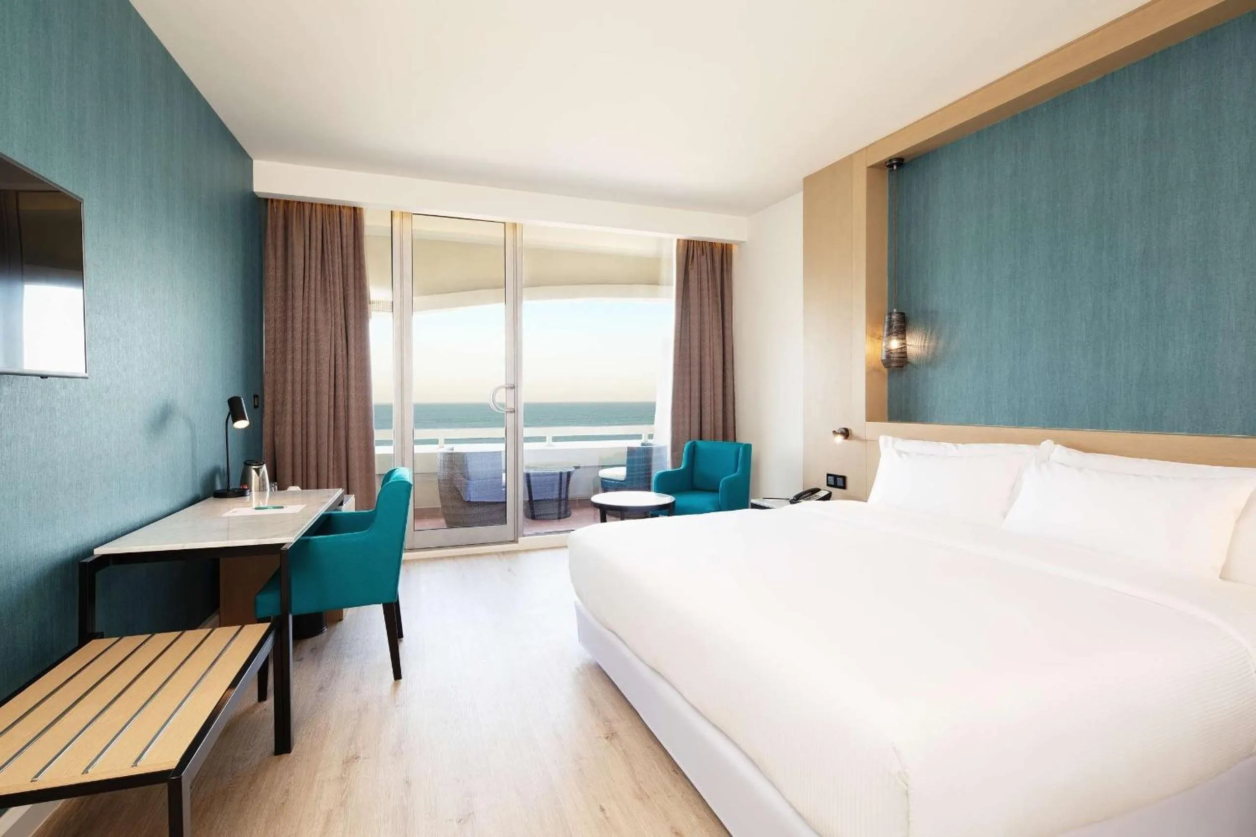 Deluxe Sea View with balcony (2 adults + 1 child) in Occidental Sharjah Grand