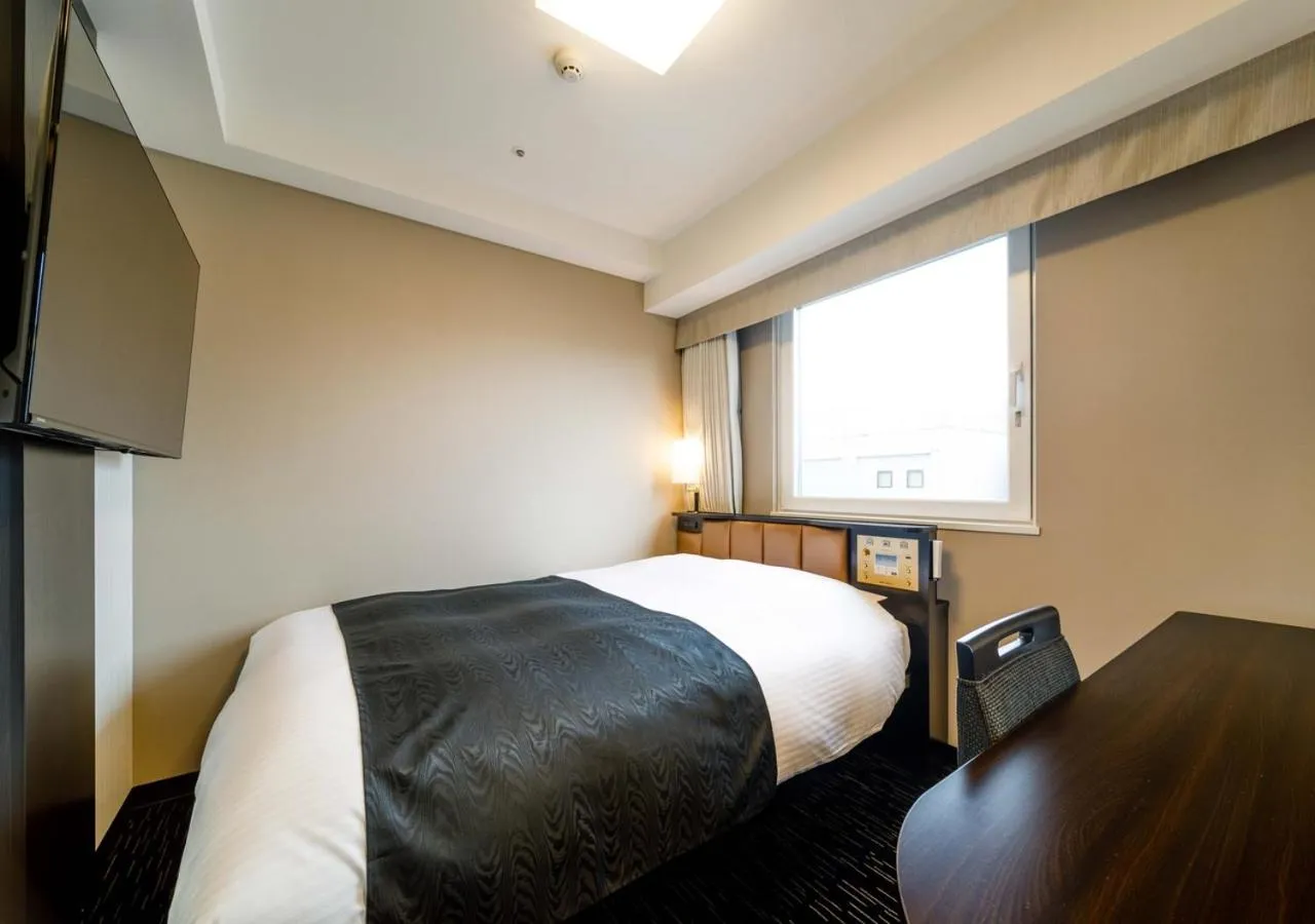Photo of the whole room, Bed in APA Hotel Hakata Ekimae 2Chome