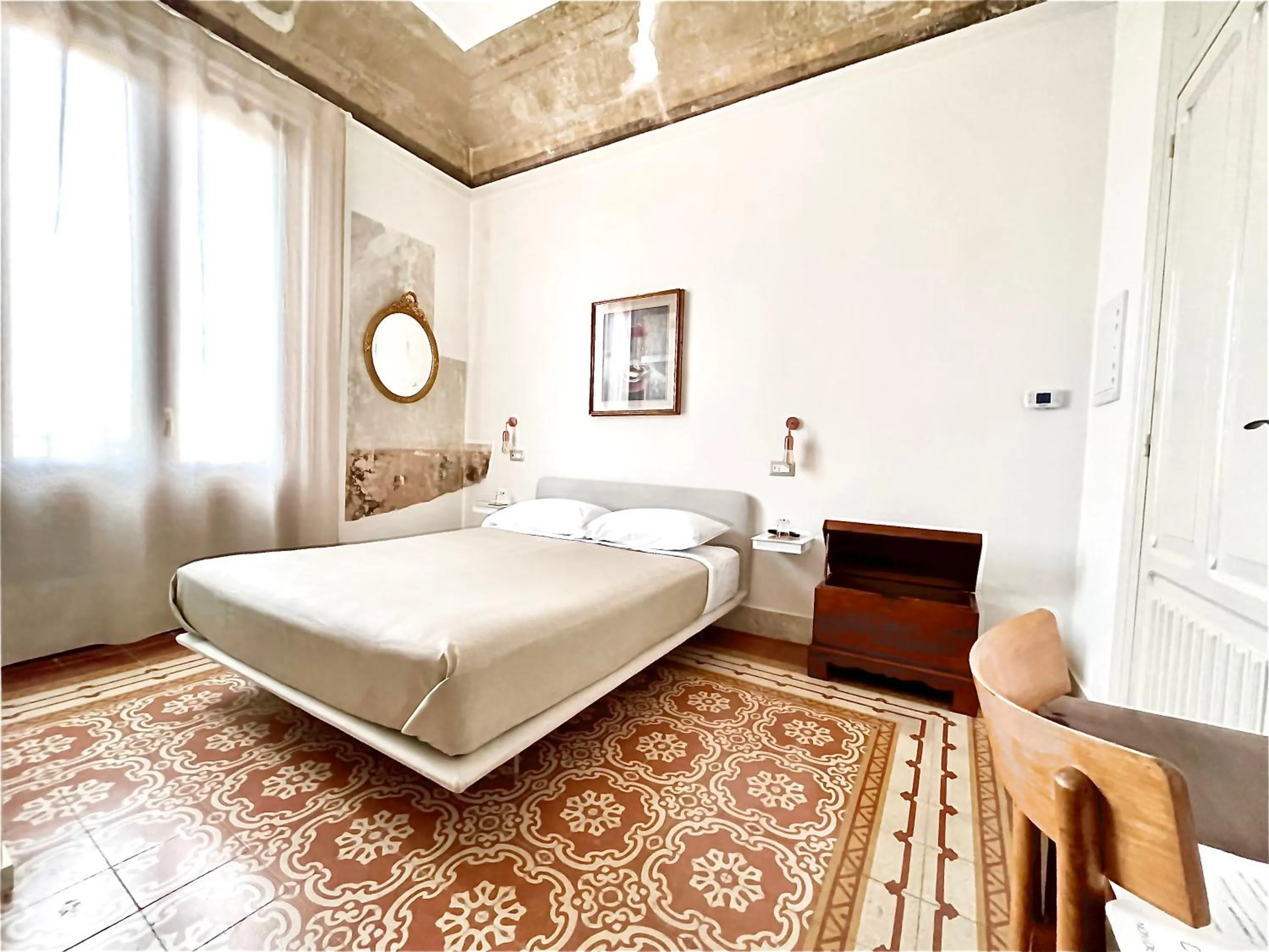 Bed in DOMUS ALERIA Deluxe Rooms