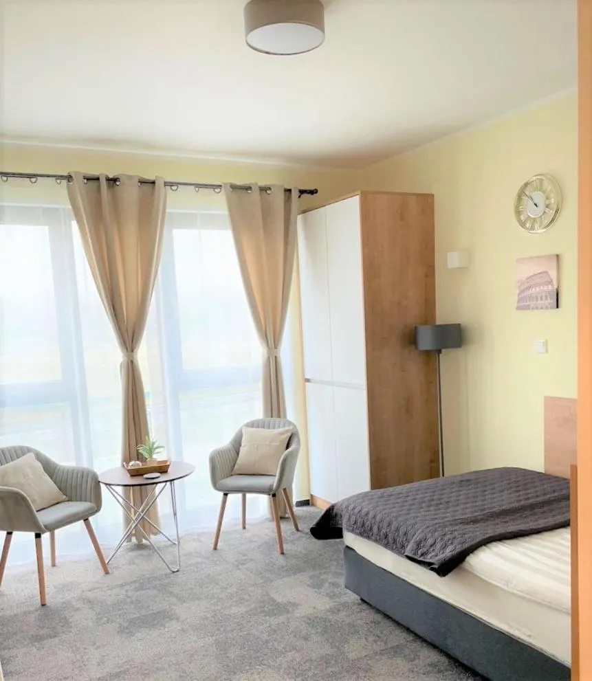 Seating area, Bed in LikeDaheim Apartments