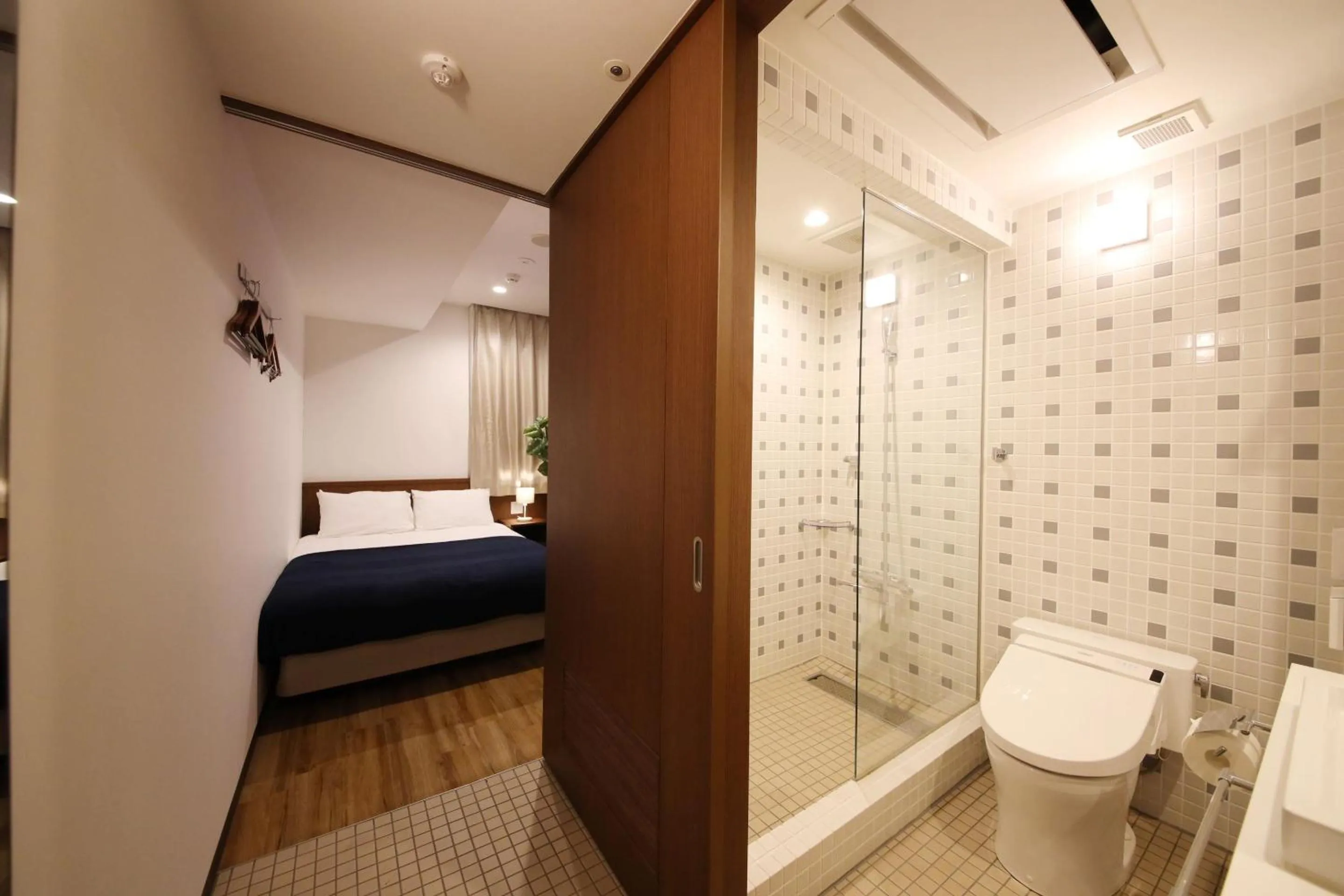 Bathroom, Bed in ZONK HOTEL Hakata