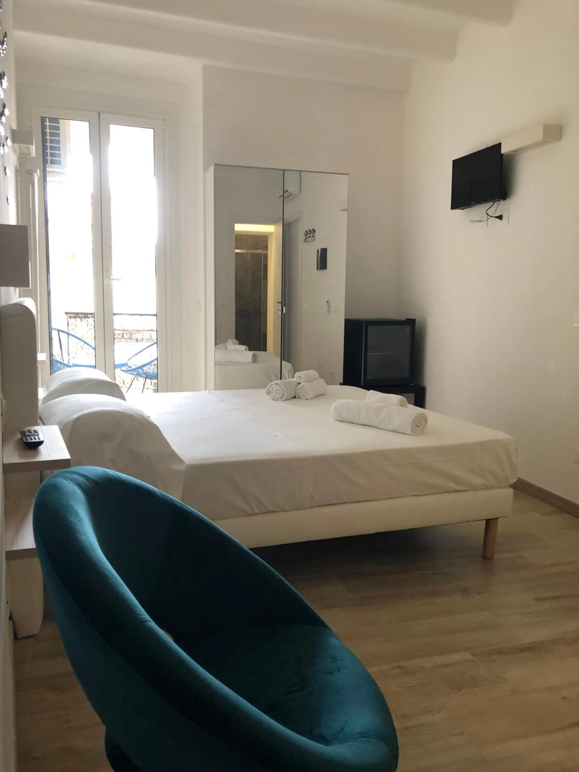 Bed in PORTOROSSO Rooms