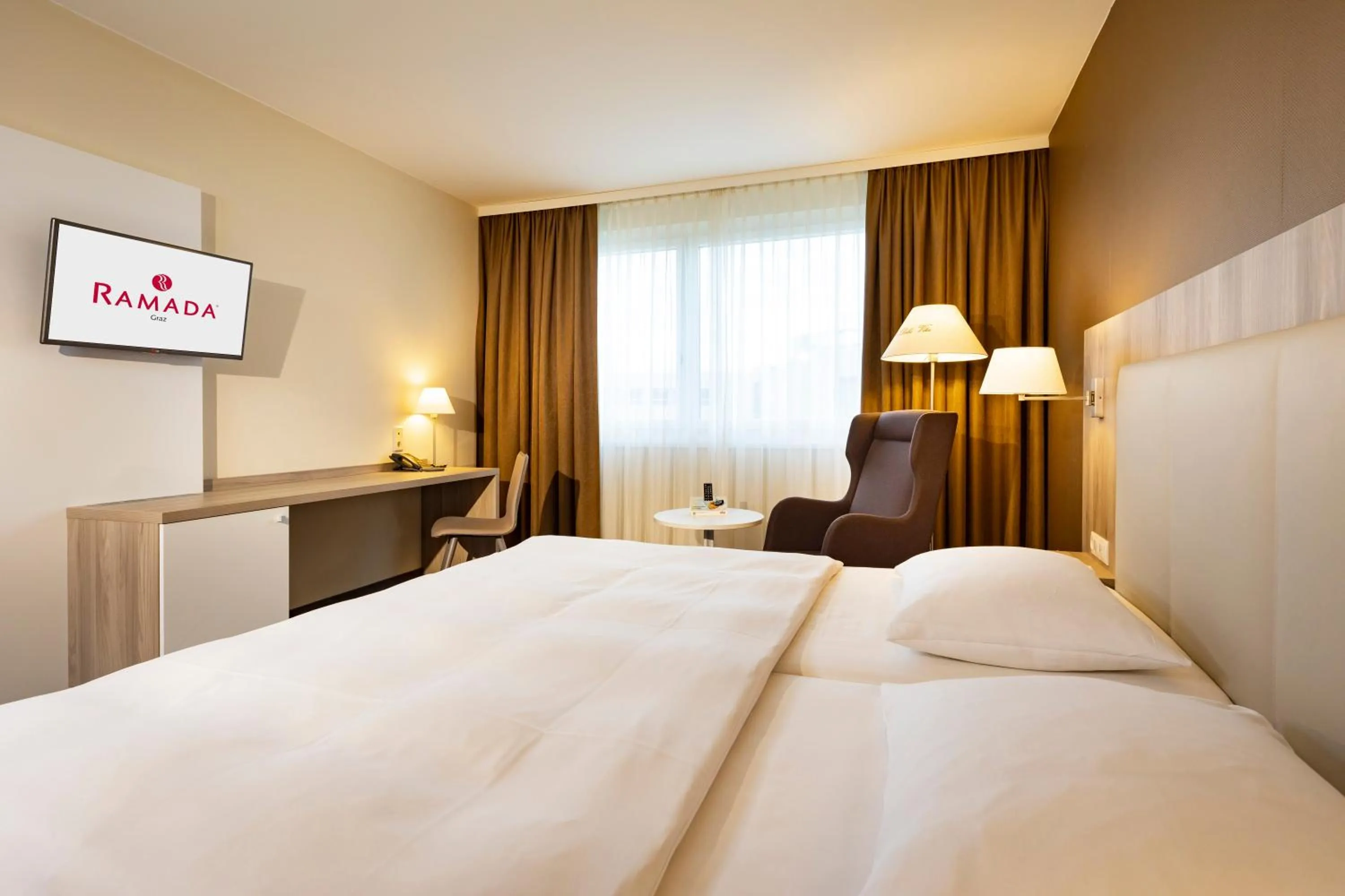Bed in Hotel Ramada by Wyndham Graz
