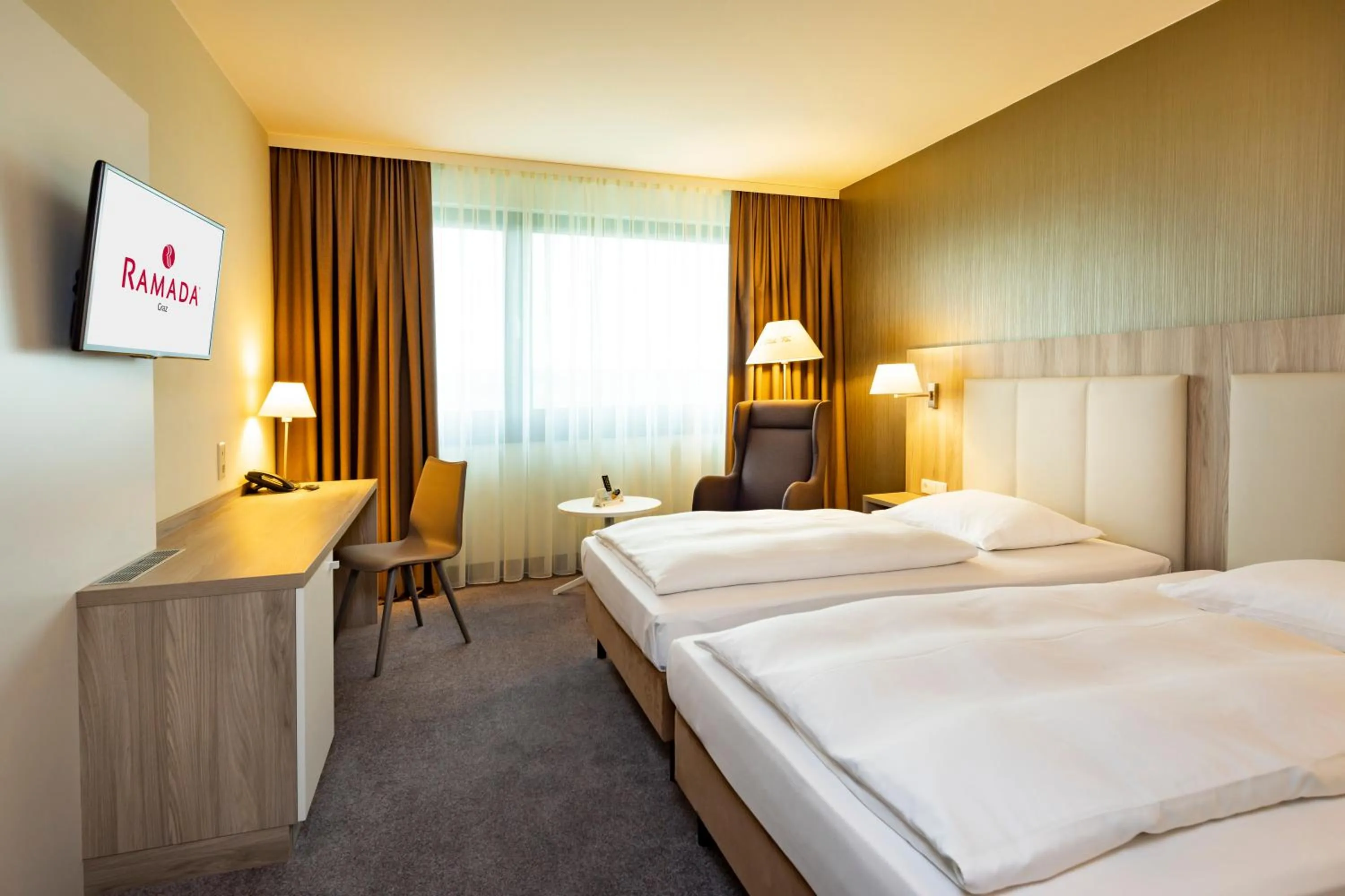 Bed in Hotel Ramada by Wyndham Graz