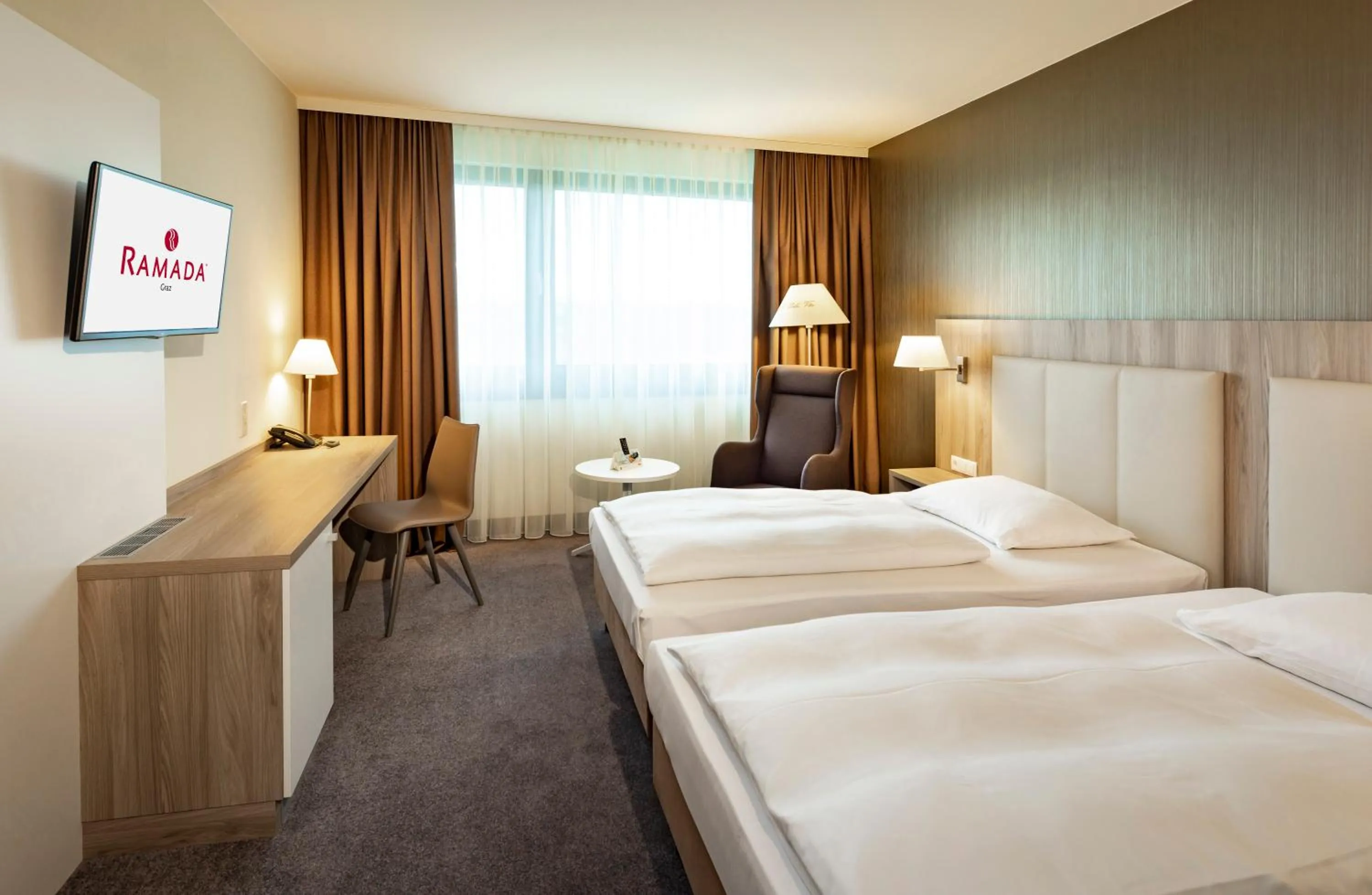 Bed in Hotel Ramada by Wyndham Graz