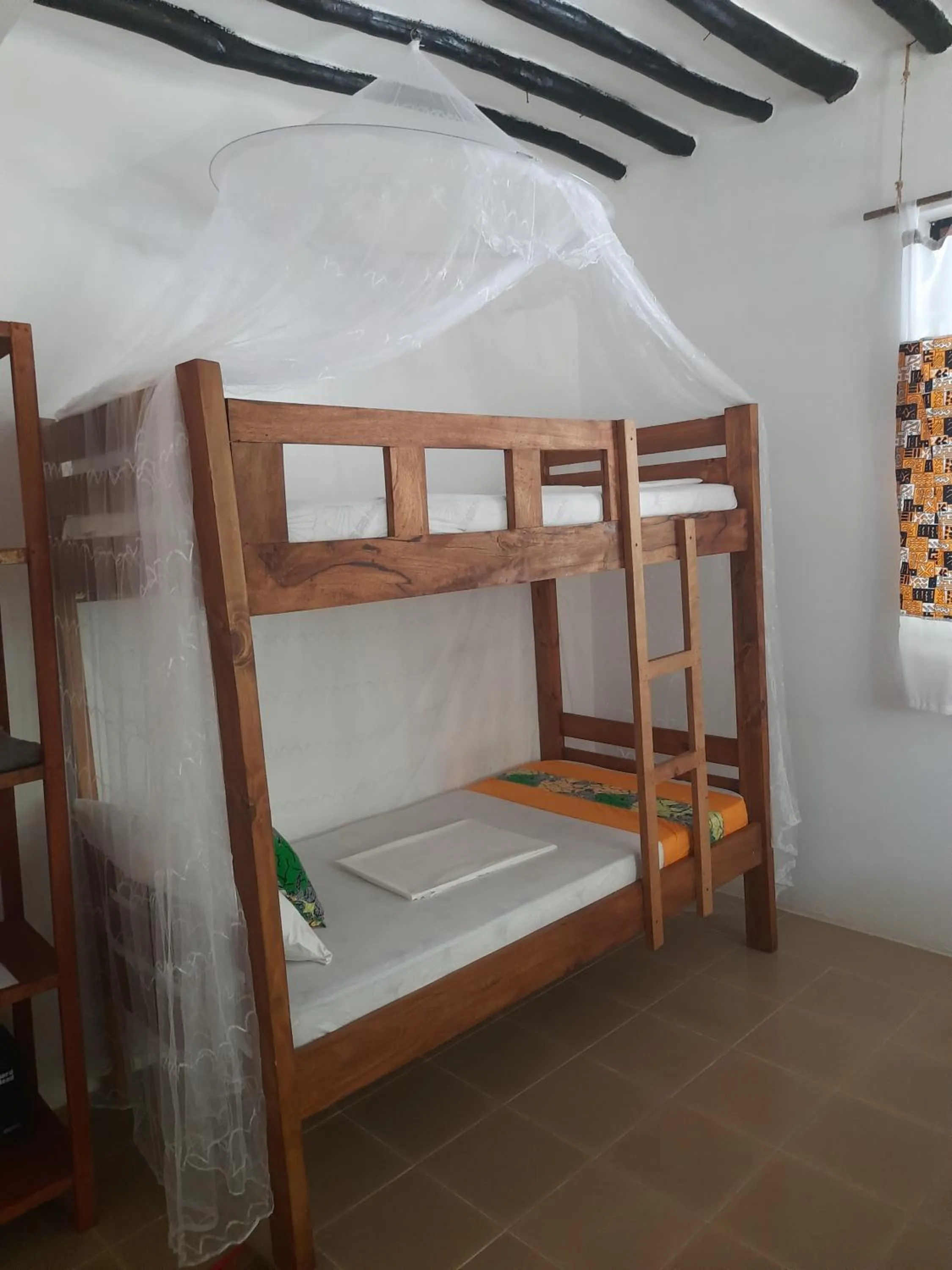 Photo of the whole room, Bed in Zanzibar Gem Beach Bungalows