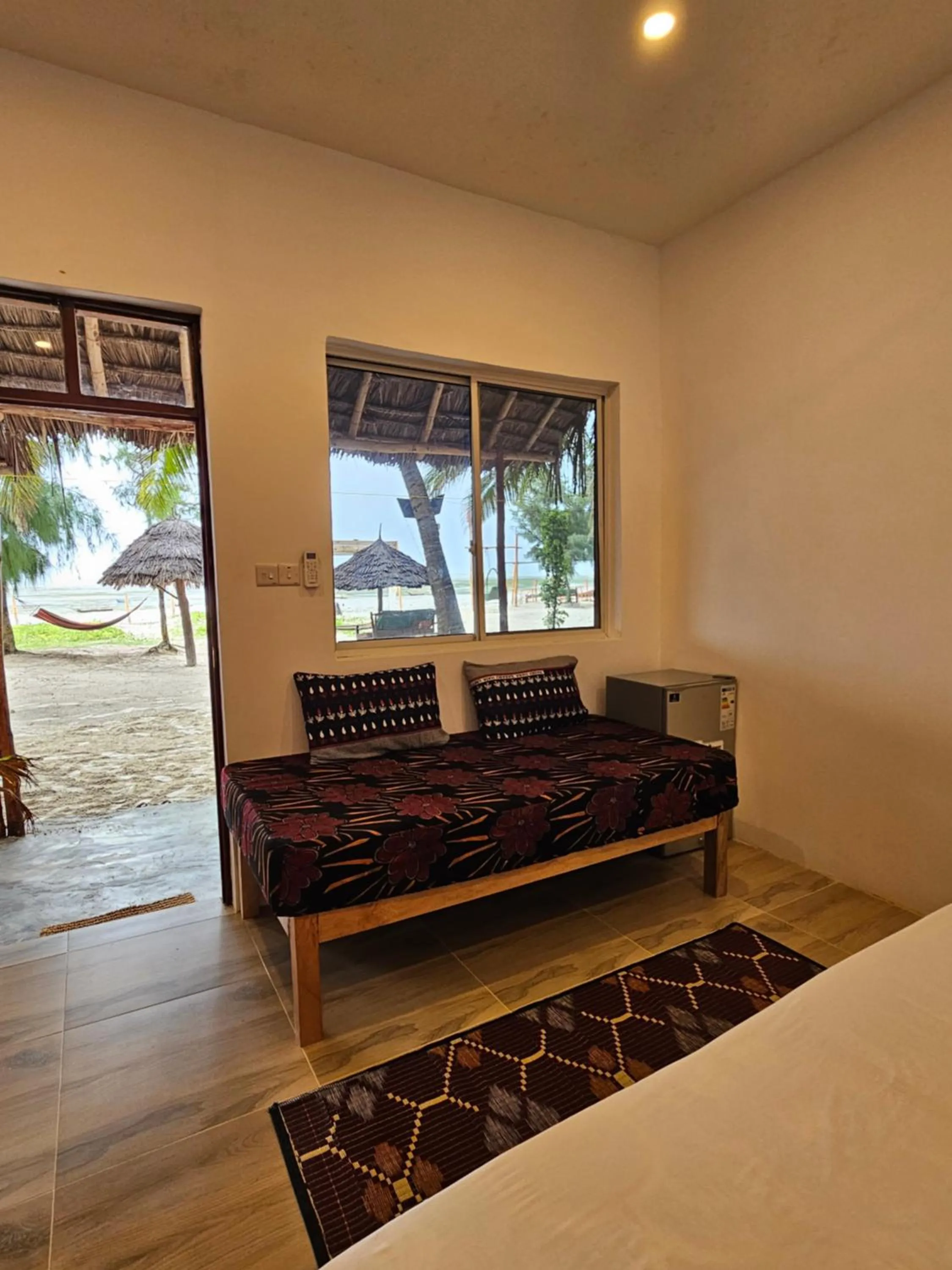 Seating area, Bed in Zanzibar Gem Beach Bungalows