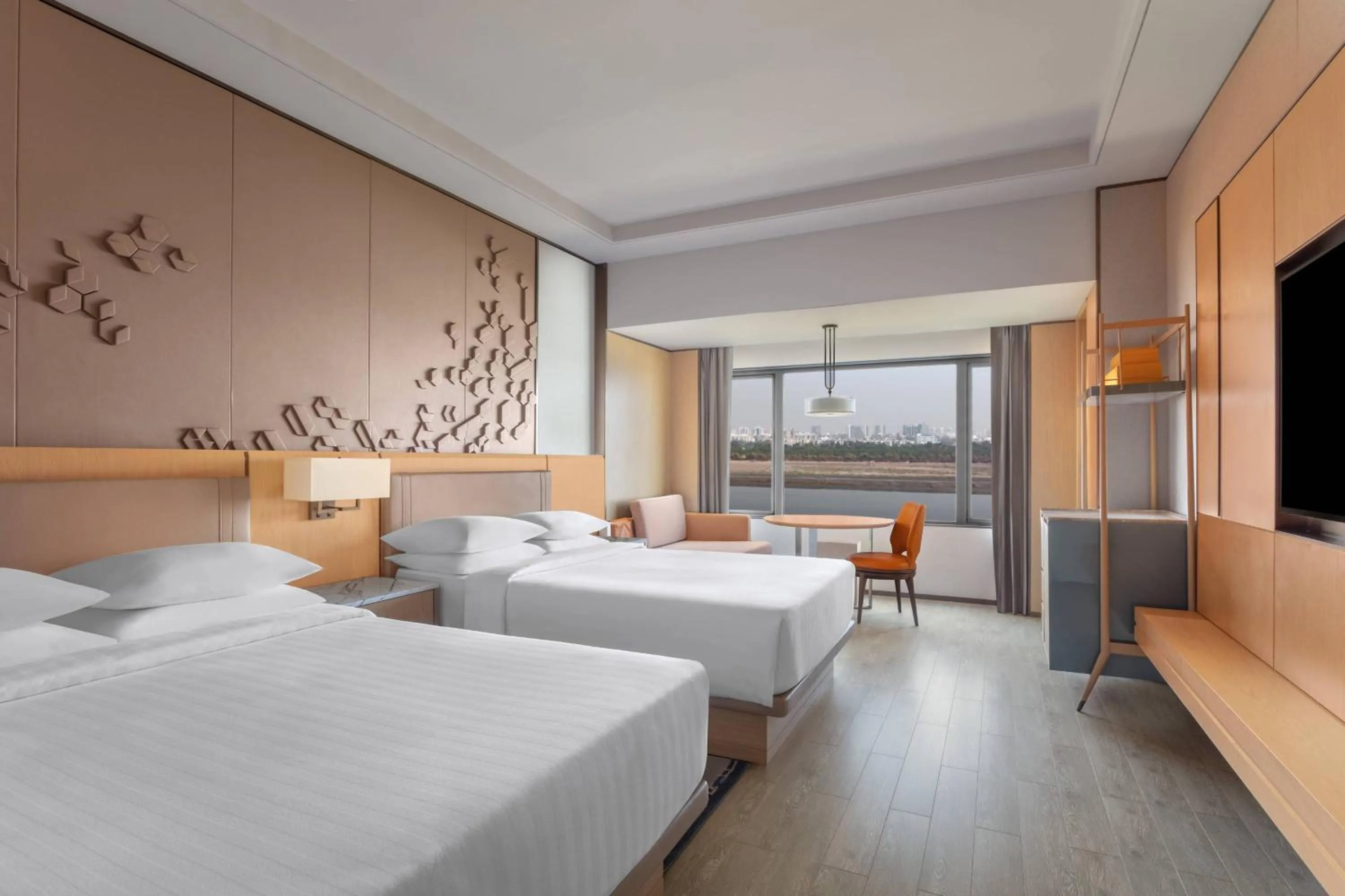 Photo of the whole room, Bed in Surat Marriott Hotel