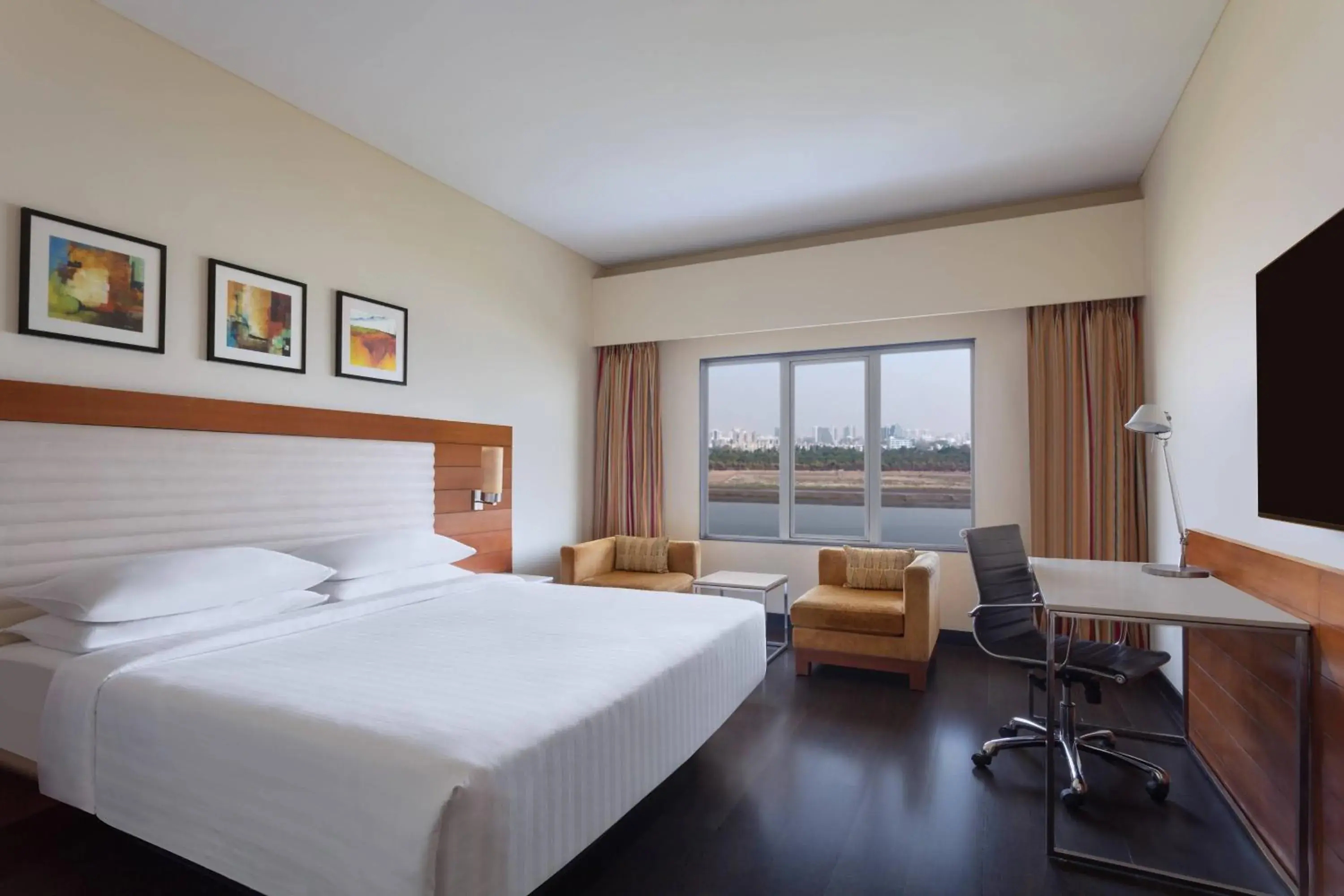 Deluxe Guest room, 1 King, River view in Surat Marriott Hotel Deluxe Guest room, 1 King, River view in Surat Marriott Hotel