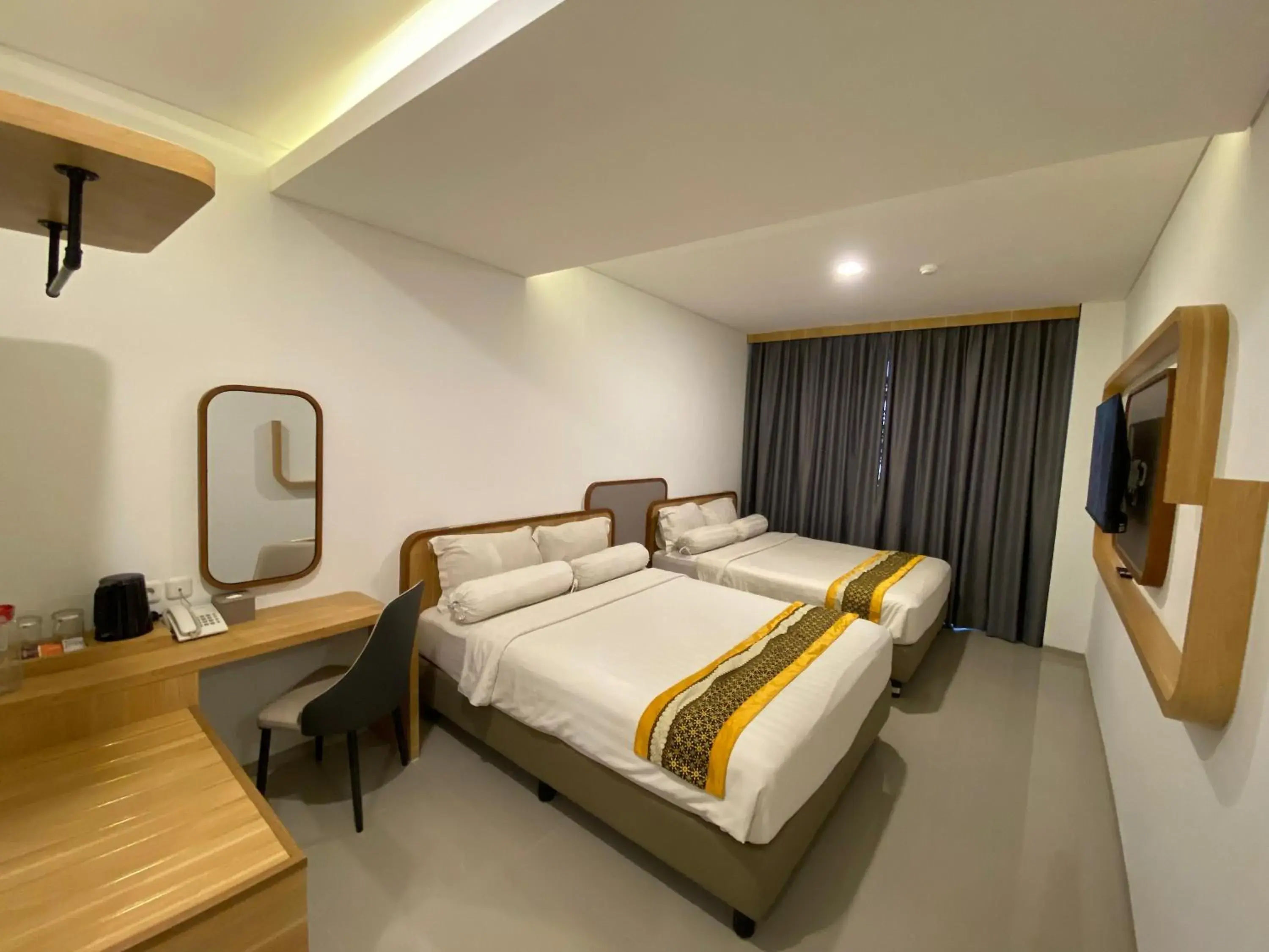 Deluxe Double Room with Two Double Beds in Front One The Andia Boyolali Deluxe Double Room with Two Double Beds in Front One The Andia Boyolali