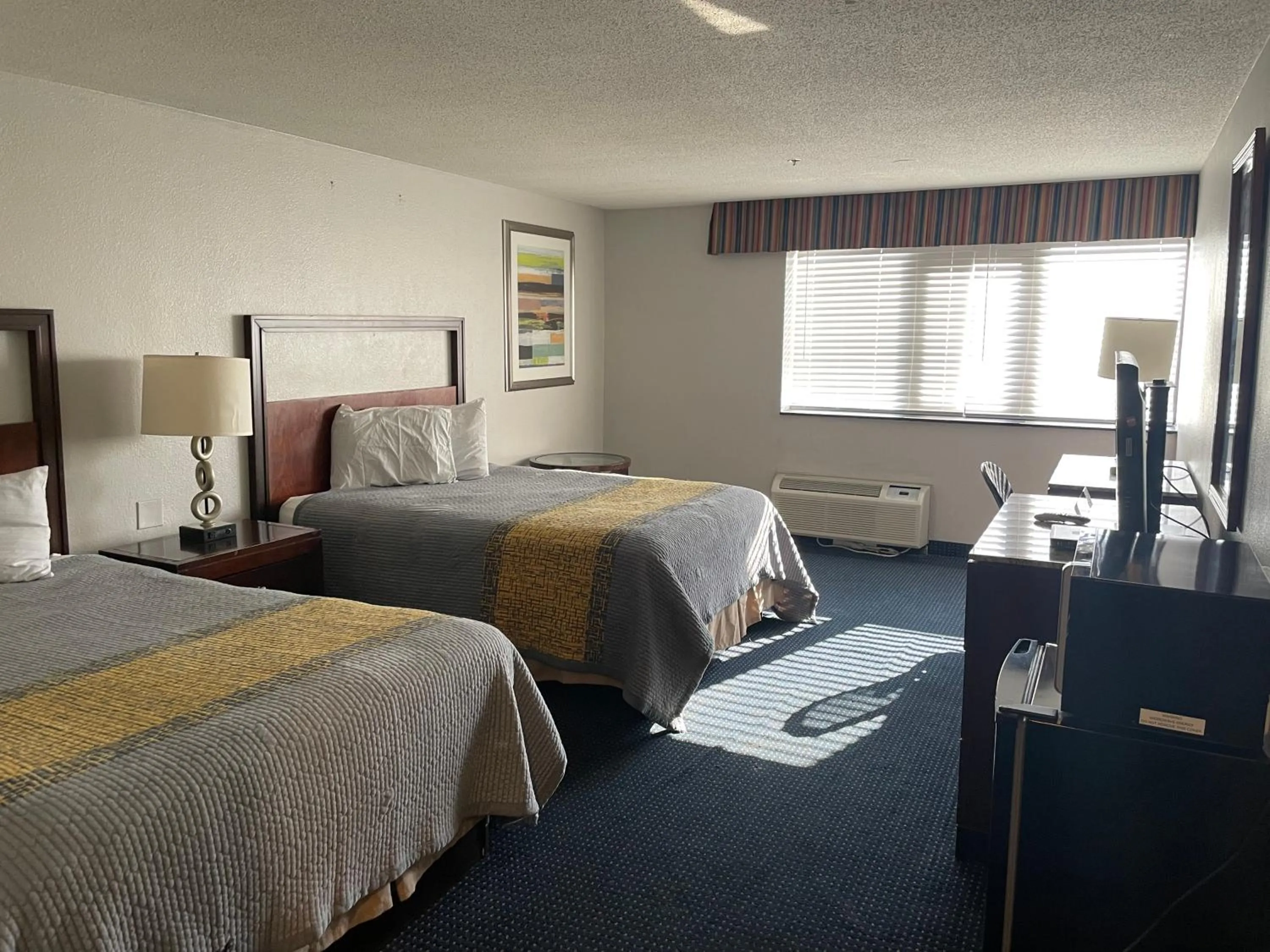 Bed in Apm Inn & Suites